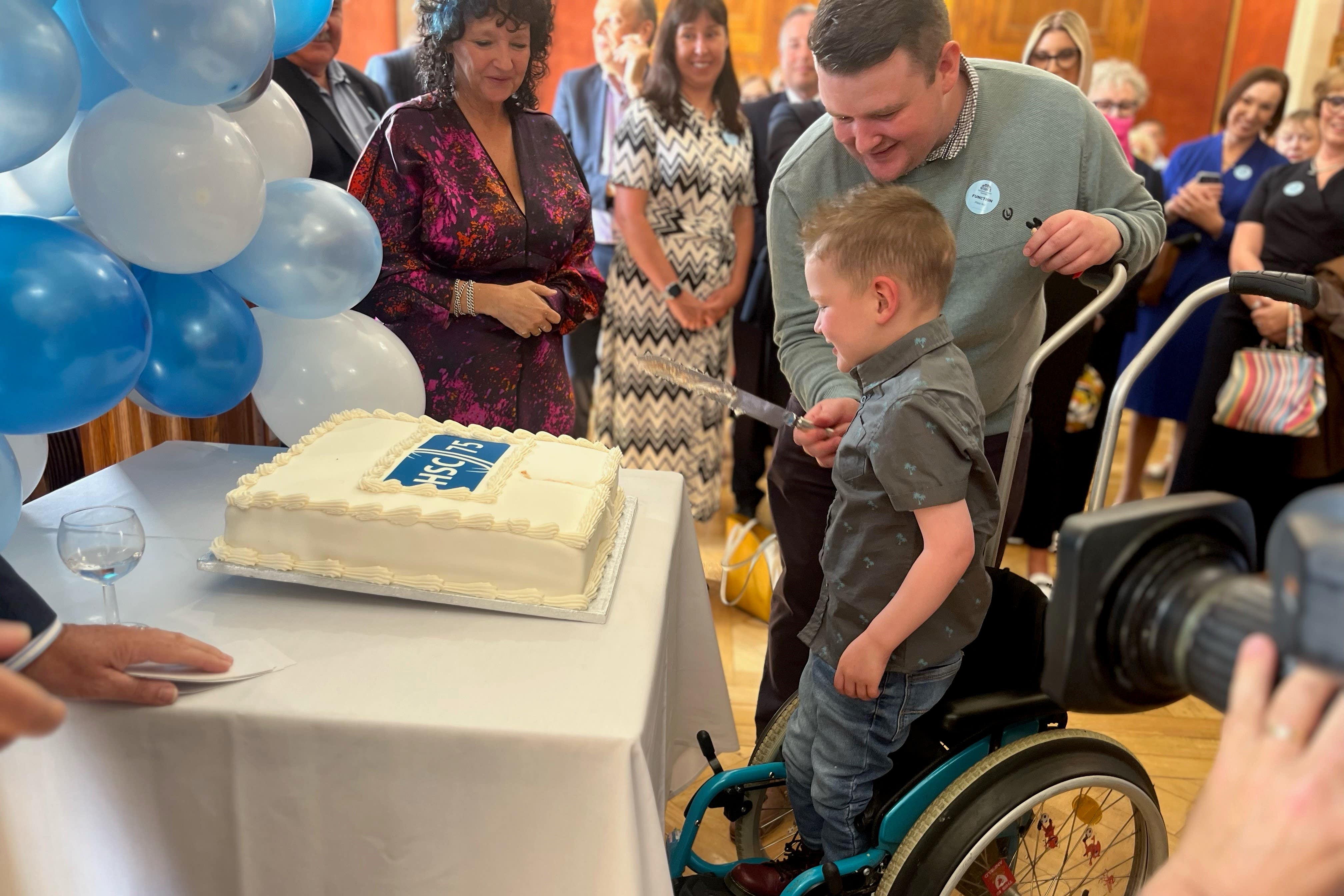 Daithi Mac Gabhann cutting the cake (Claudia Savage/PA)