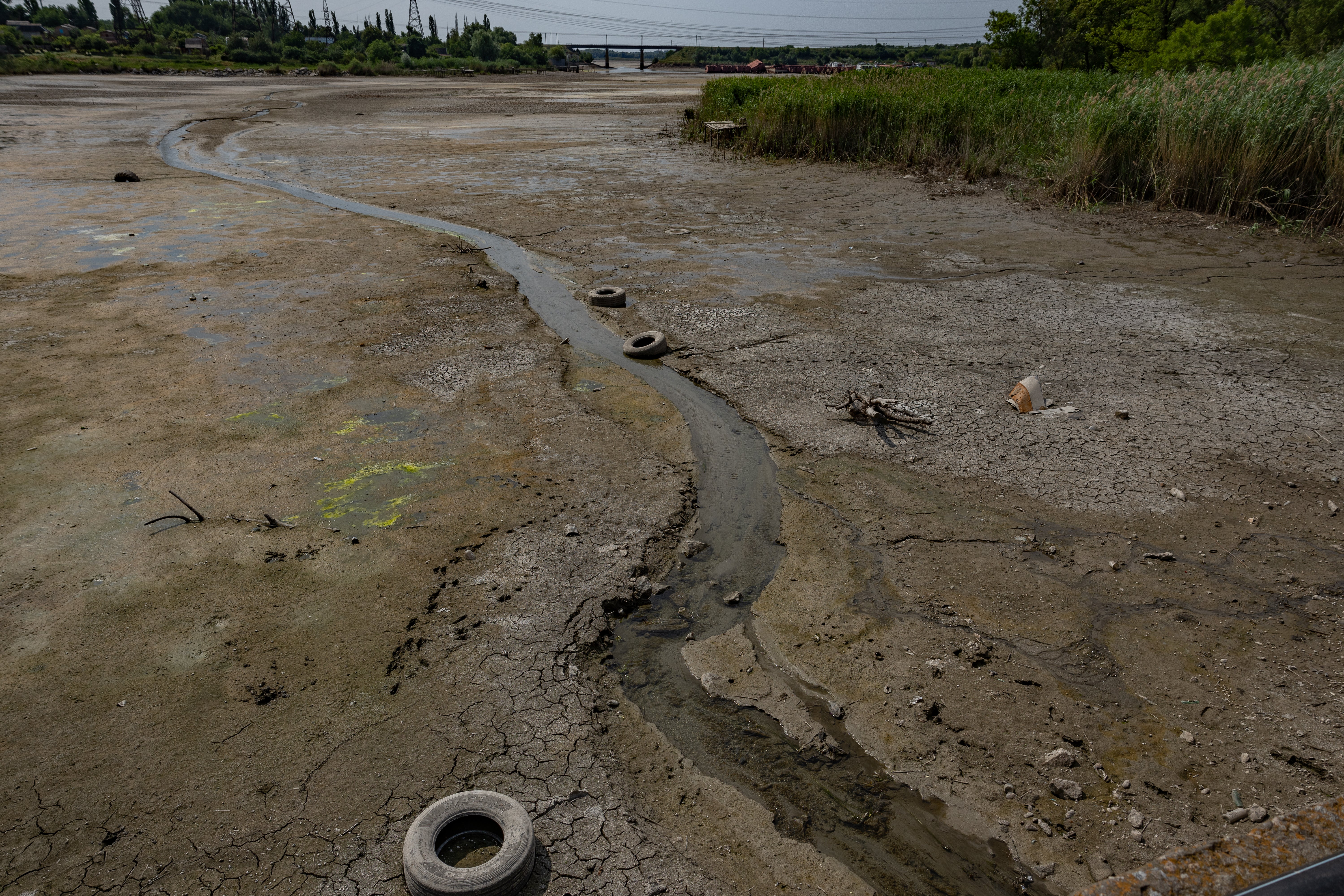 Ukraine says that Russia blew up a dam emptying the Kakhovka reservoir that Nikopol relies on