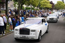 Thousands of mourners line streets for funeral of boys killed in Cardiff crash that sparked riots