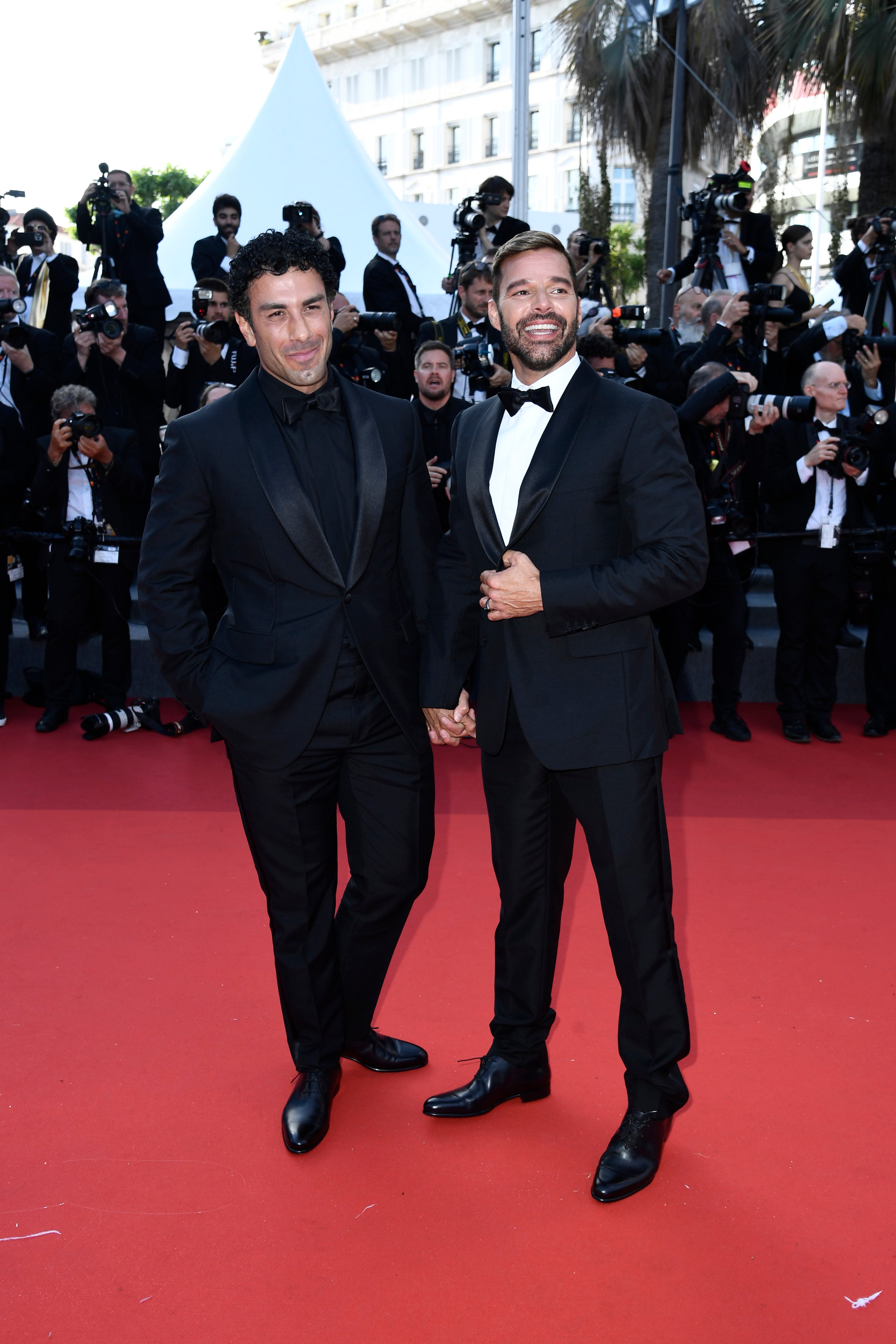 Jwan Yosef and Ricky Martin attend the screening of "Elvis" during the 75th annual Cannes film festival at Palais des Festivals on May 25, 2022