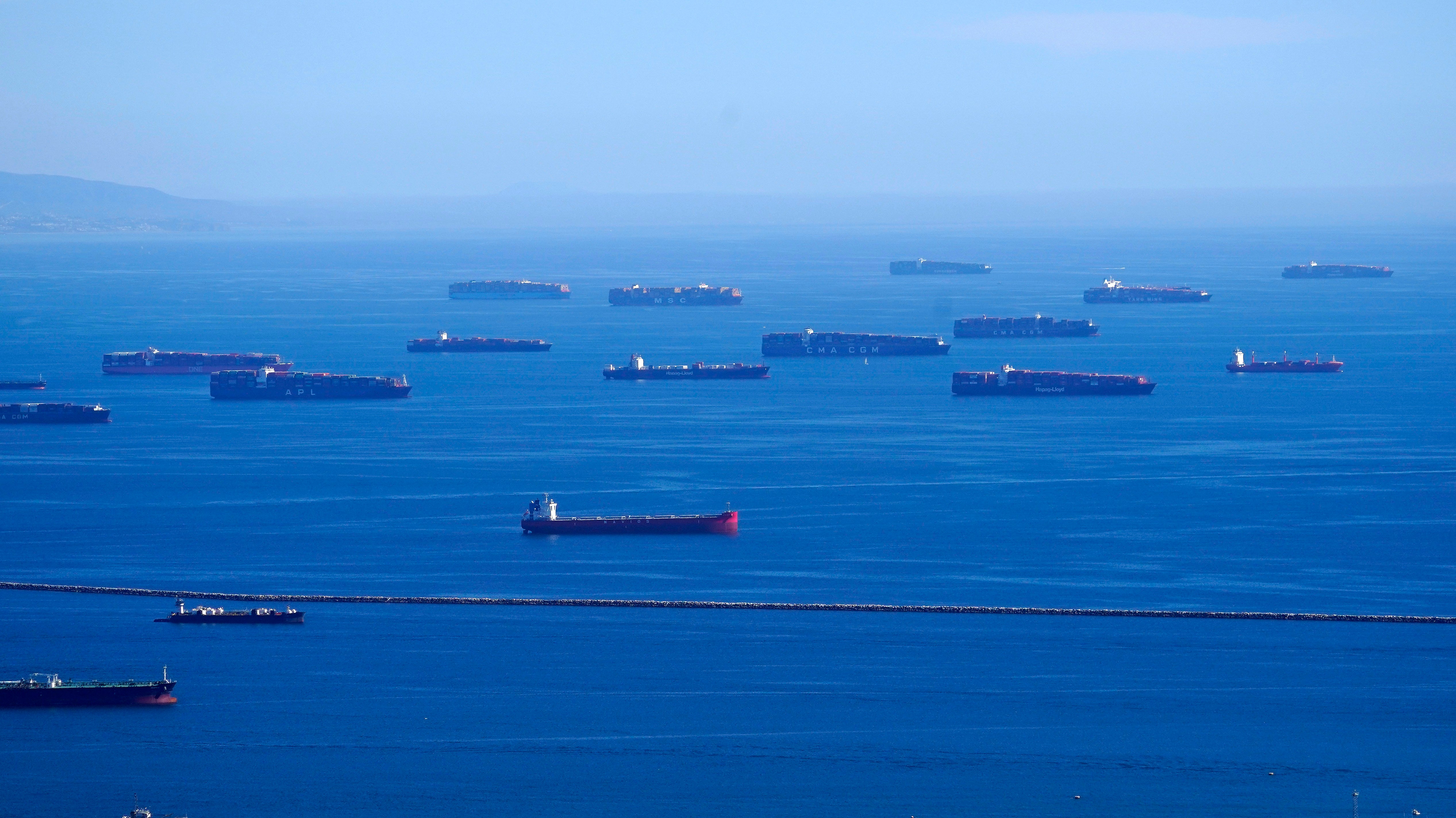 FILE - Cargo ships are seen lined up outside the Port of Los Angeles
