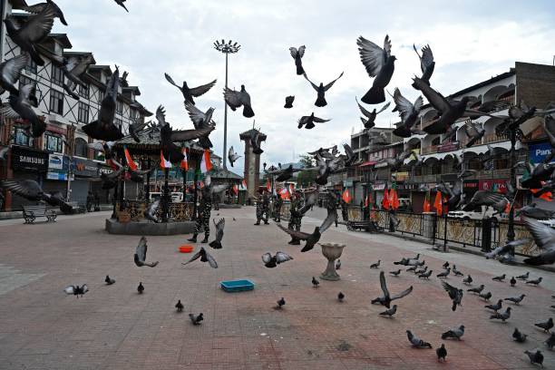 Indian paramilitary troopers patrol during the Bharatiya Janata Party's (BJP) Tiranga bikers rally at the clock tower in Lal Chowk area of Srinagar on