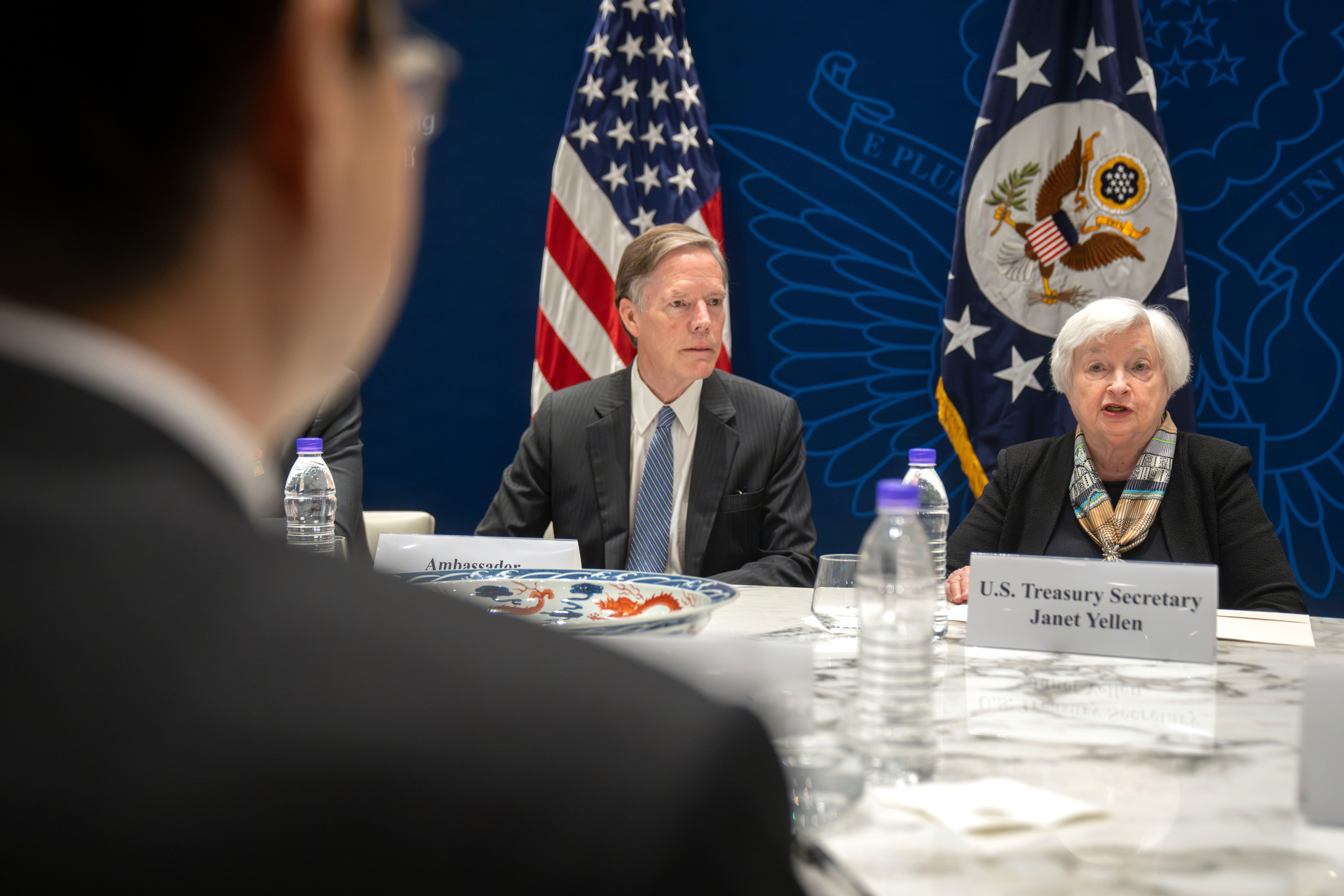 US ambassador to China Nicholas Burns, centre, listens as the Treasury secretary speaks at a climate finance roundtable discussion at the US embassy in Beijing on Saturday