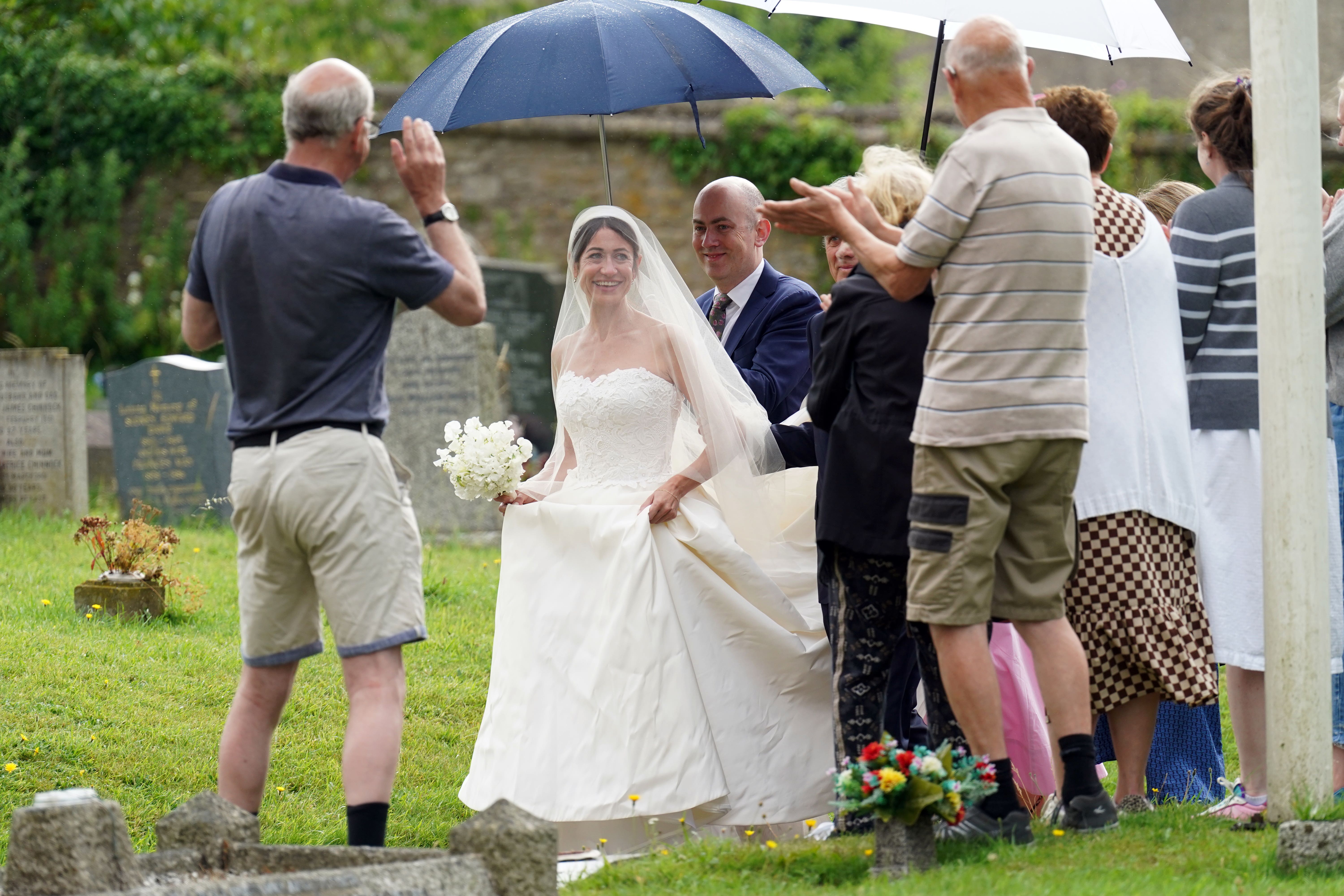 Thea Rogers arrives at St Mary’s Church in Brunton, Somerset (Stefan Rousseau/PA)