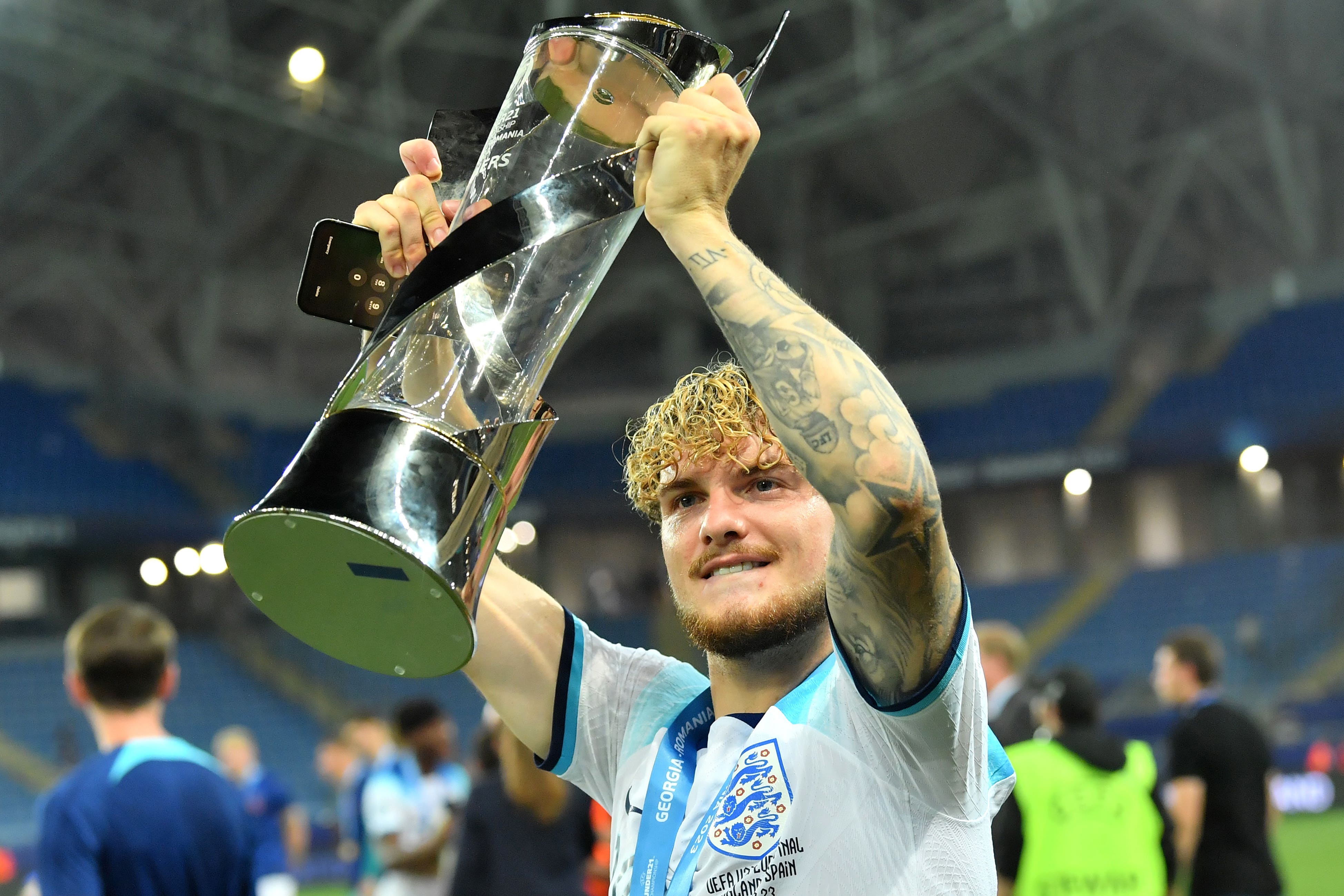 England’s Harvey Elliott lifts the trophy following the Euro Under-21 Championship final (PA)