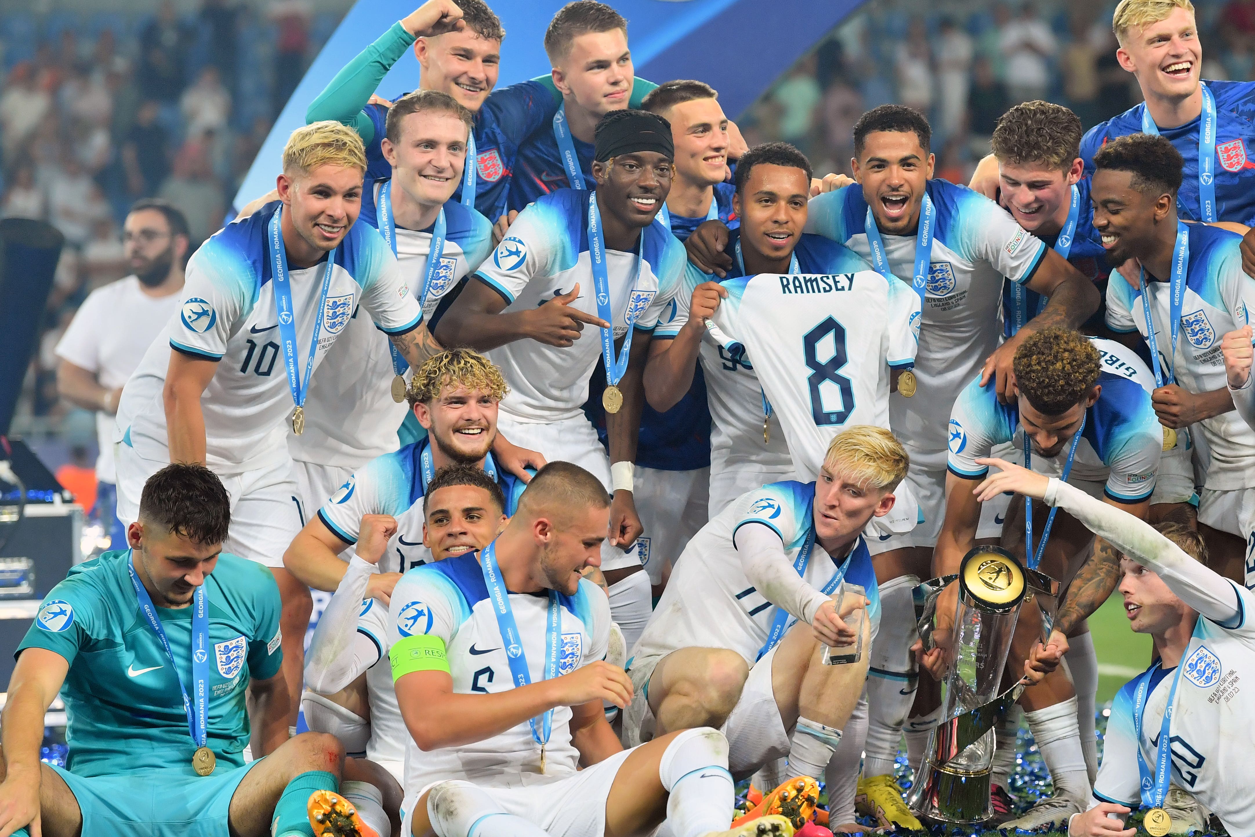 Taylor Hardwood-Bellis, front, third from right, celebrates with his England team-mates after victory over Spain (PA)