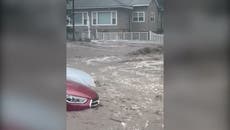 New York: Water gushes through streets as storm causes flash flooding