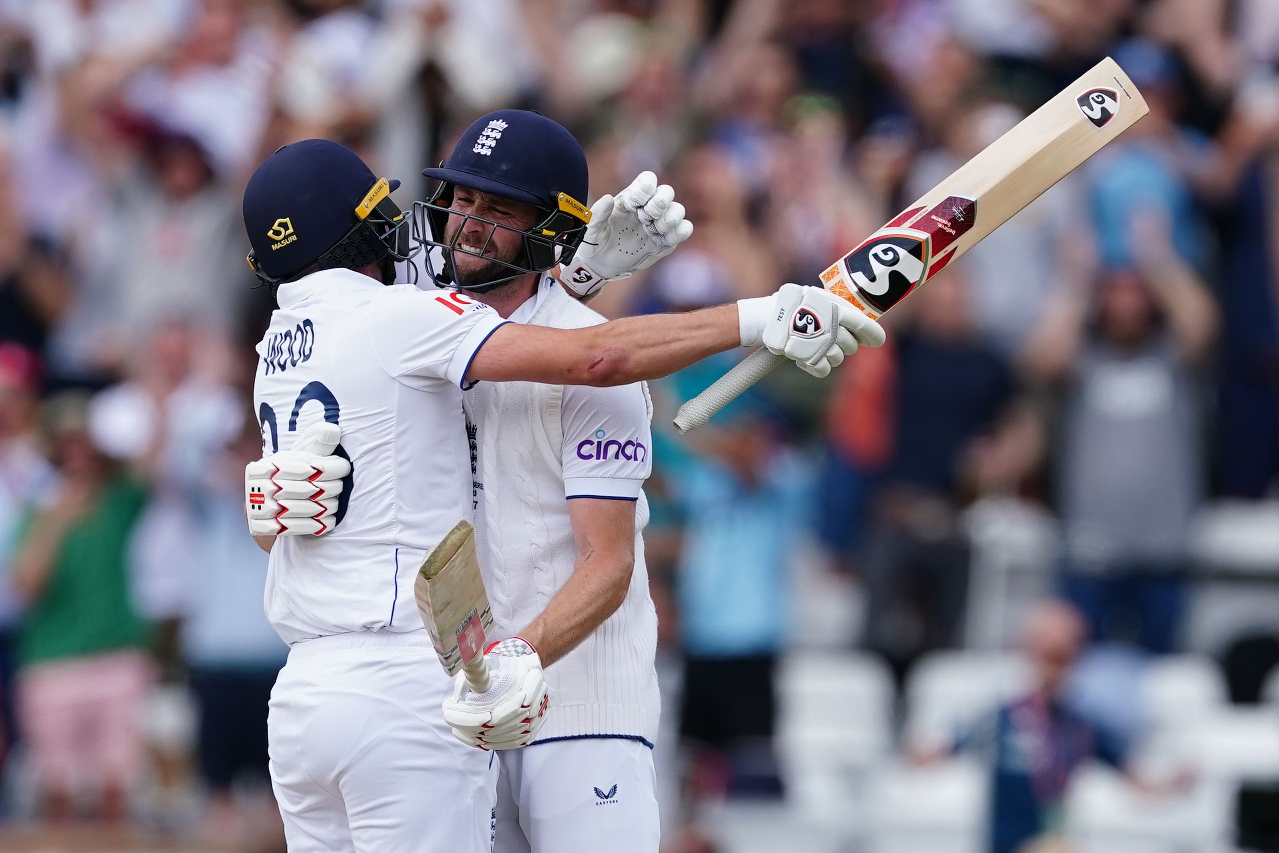 ‘It’s pretty cool. Amazing feeling’: England’s Chris Woakes and Mark Wood (left) celebrate victory in the third Test at Headingley on Sunday