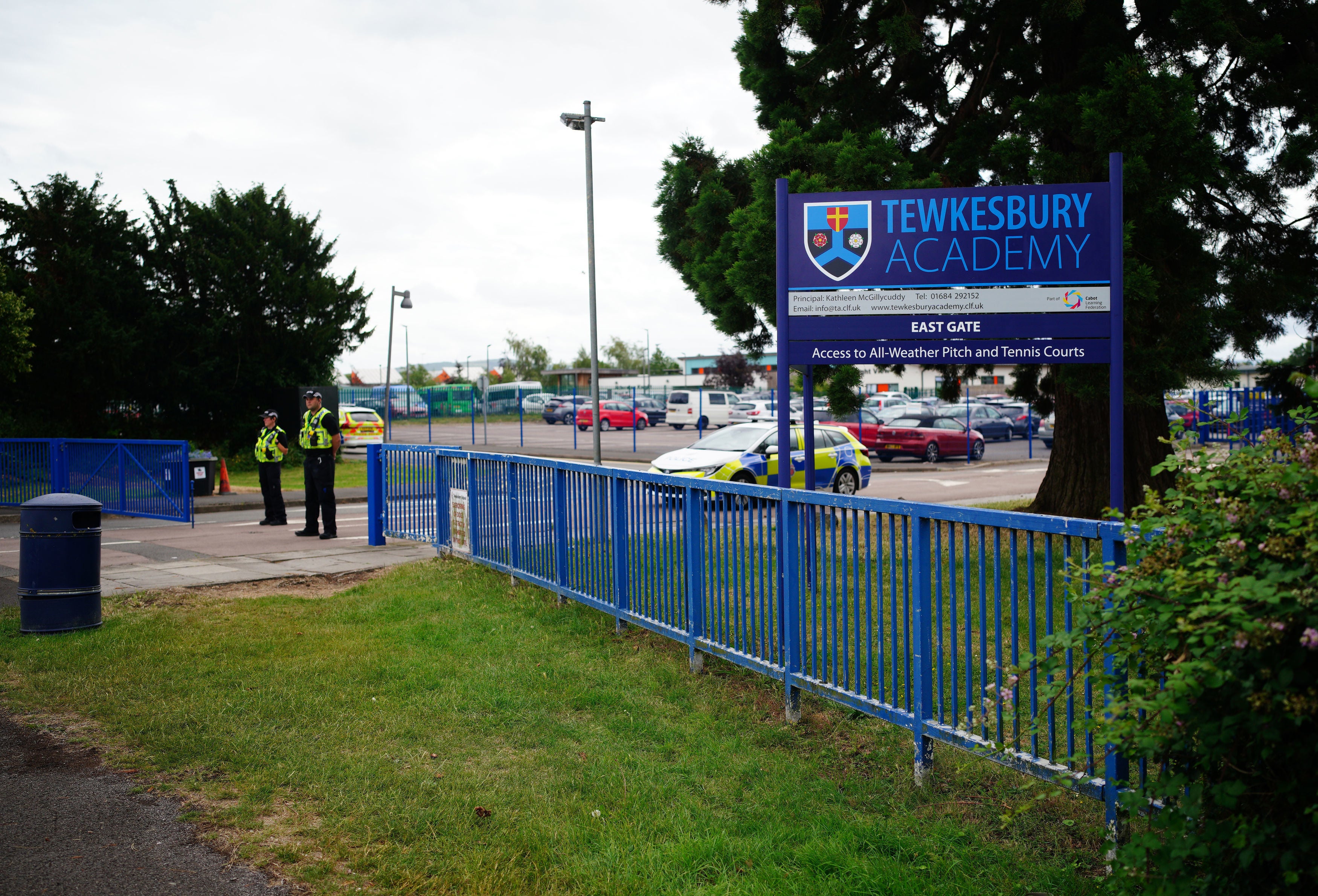 Emergency services at Tewkesbury School in Gloucestershire, which has been locked down after a teenage boy was arrested following reports a pupil stabbed a teacher