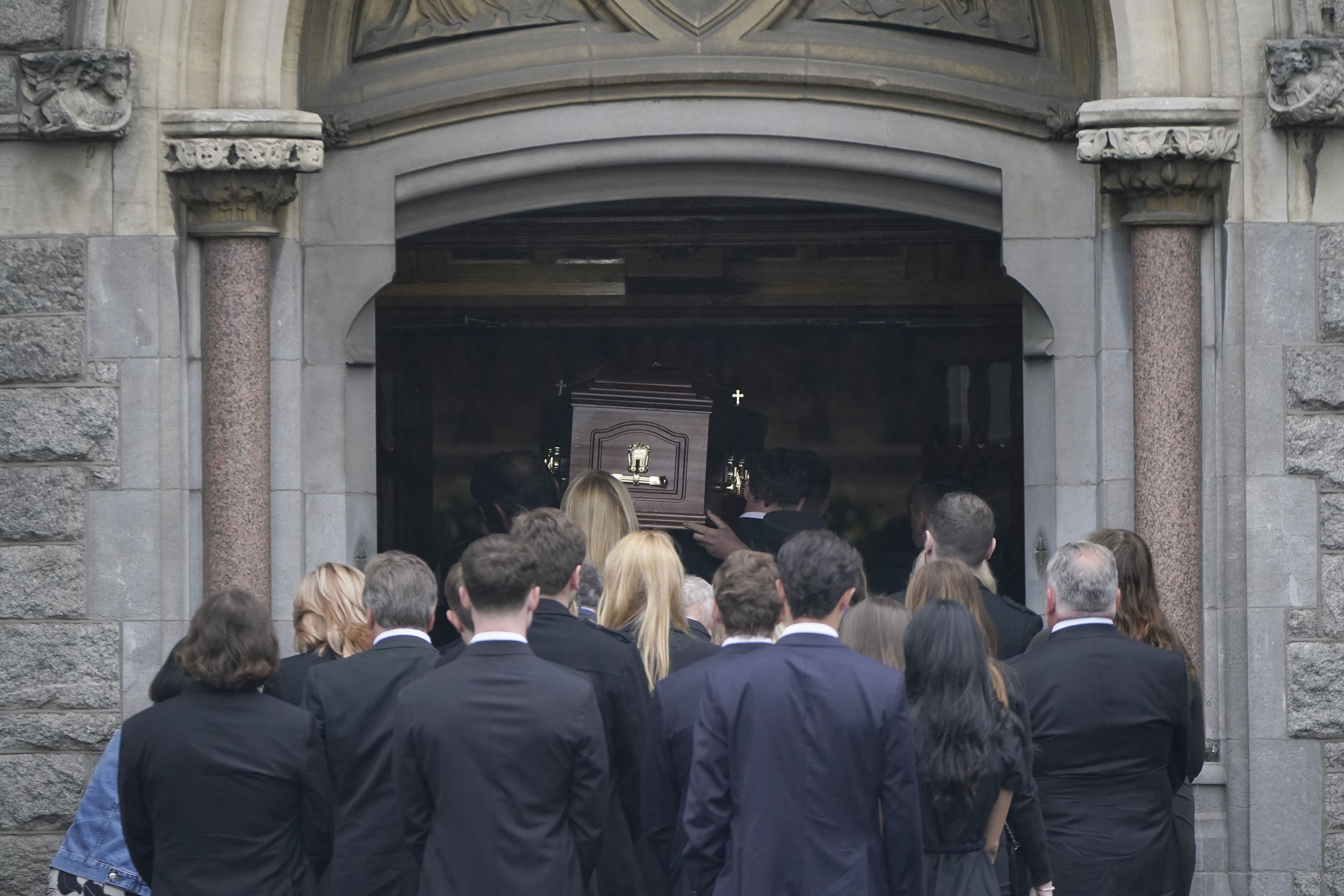 The parents of one of two Dublin school leavers who died on a Greek island holiday have paid tribute to their ‘fabulous son’ at his funeral (Niall Carson/PA)