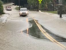 Video captures extreme flooding in New York state as one woman killed and dozens rescued from submerged cars