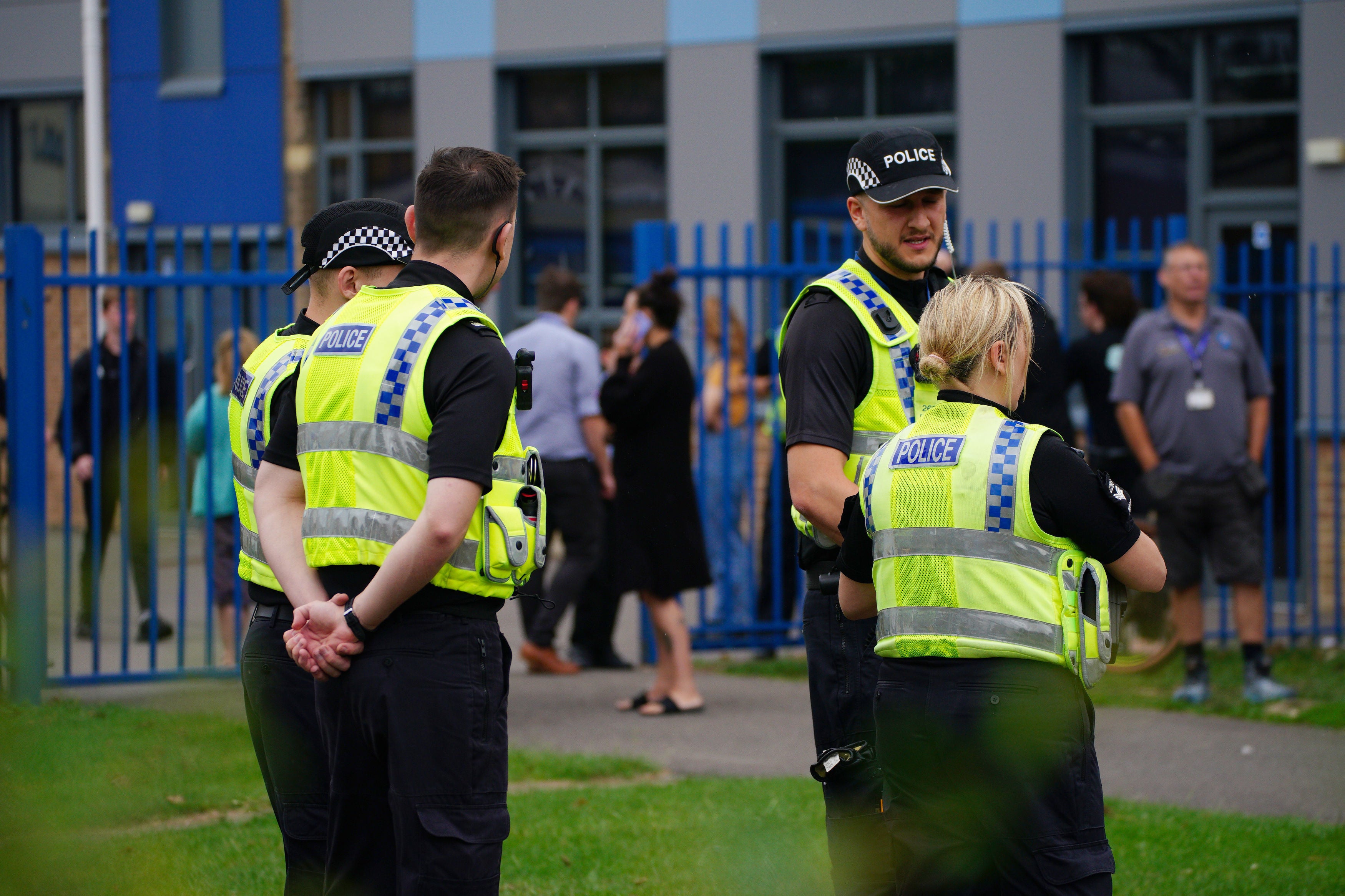 Police officers at the gates of Tewkesbury Academy