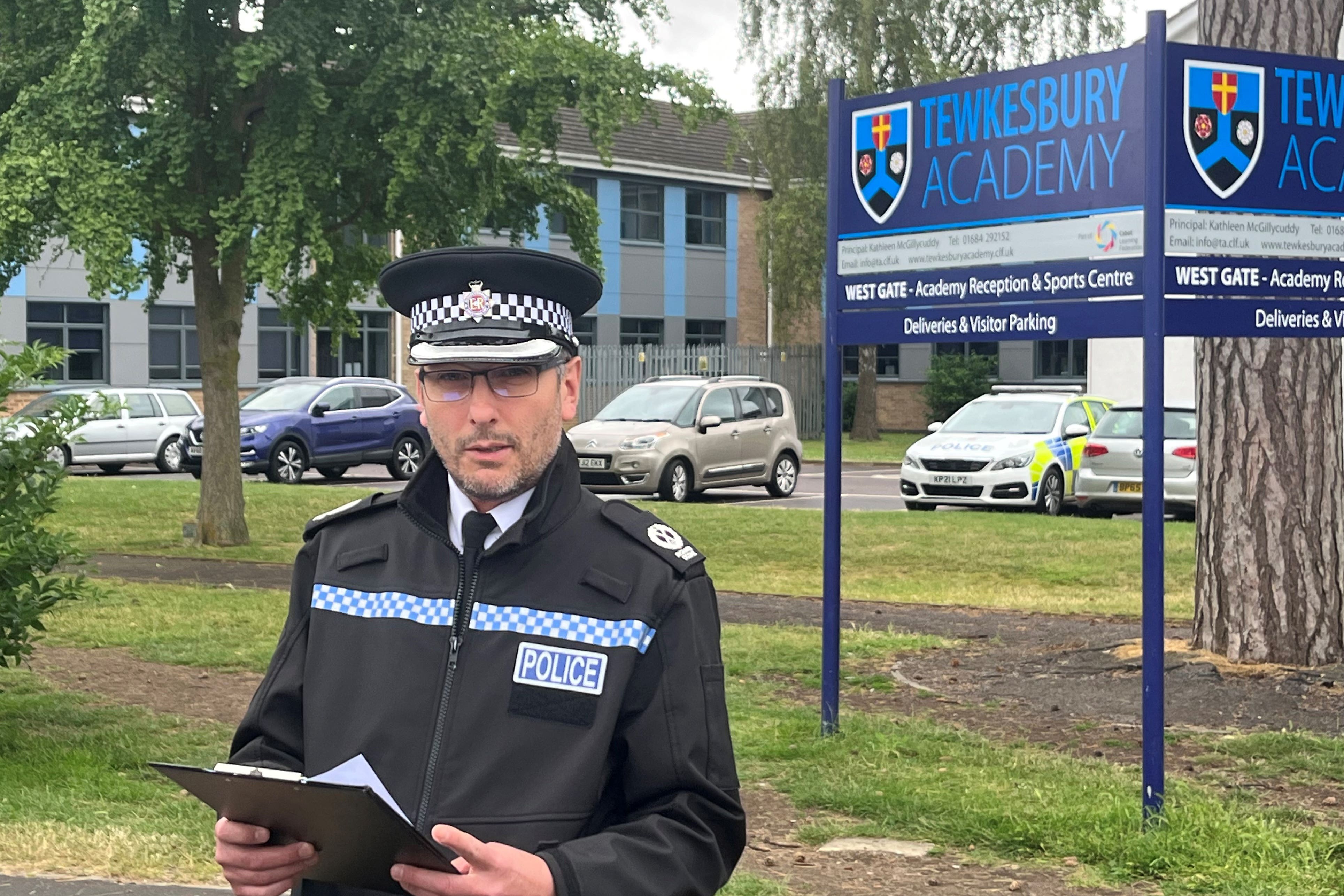 A teenage boy has been questioned on suspicion of attempted murder after the teacher was stabbed in the secondary school corridor