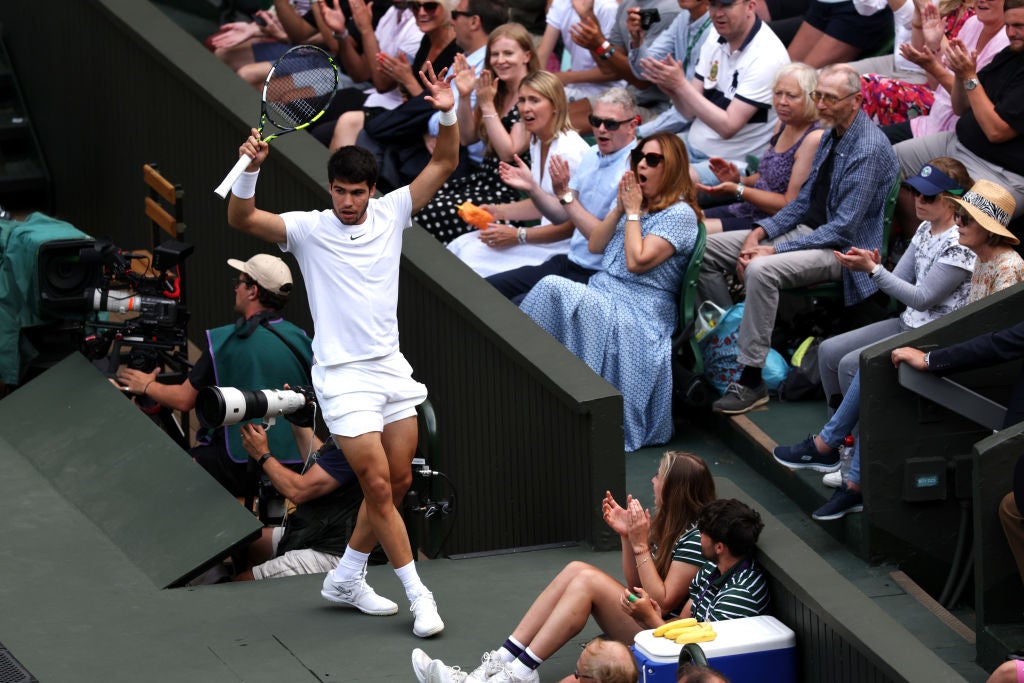 Crowd control: Alcaraz runs off the court after a shot