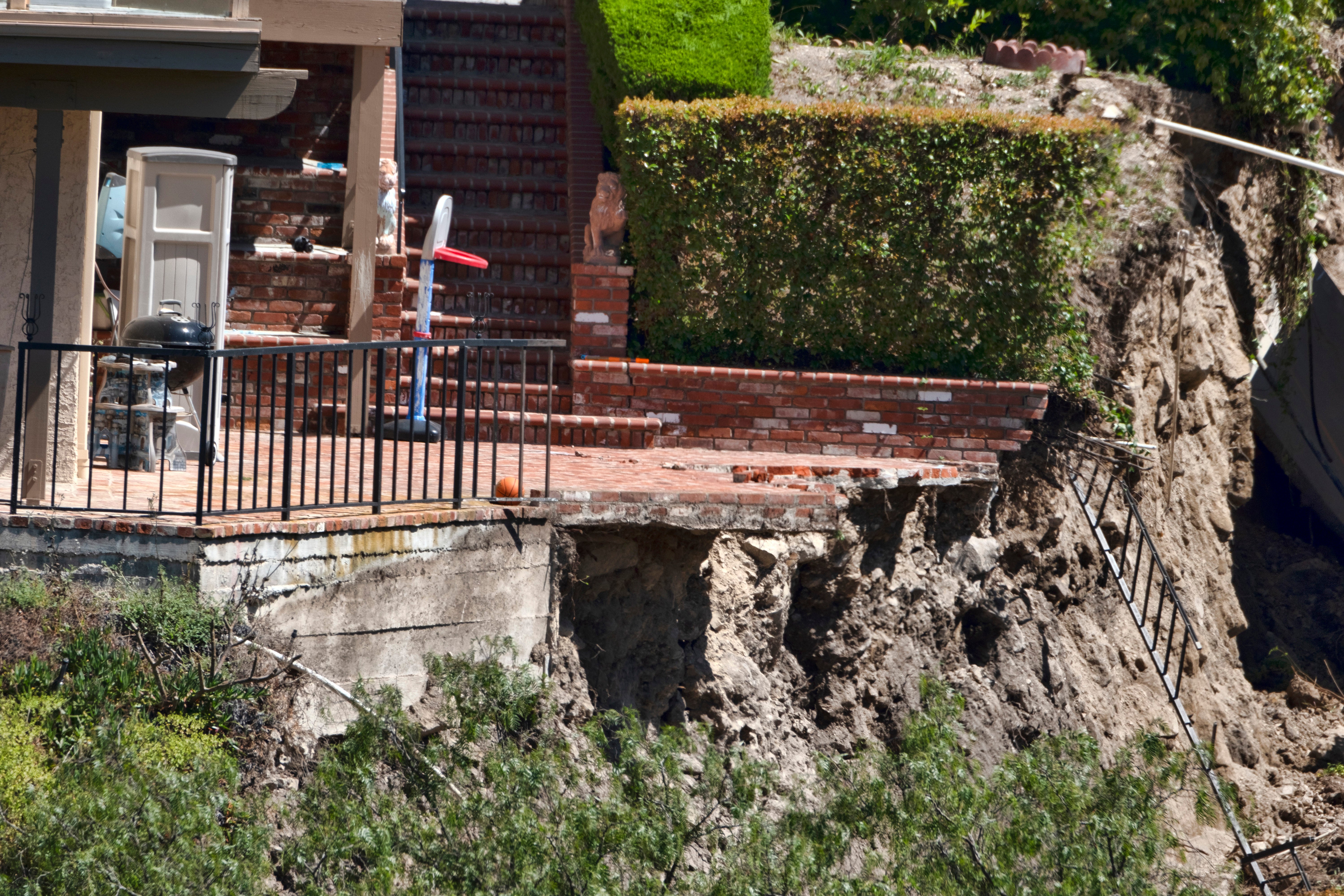 A patio of a house in Rolling Hills Estates is severely damaged after a landslide on the Palos Verdes Peninsula in Los Angeles County