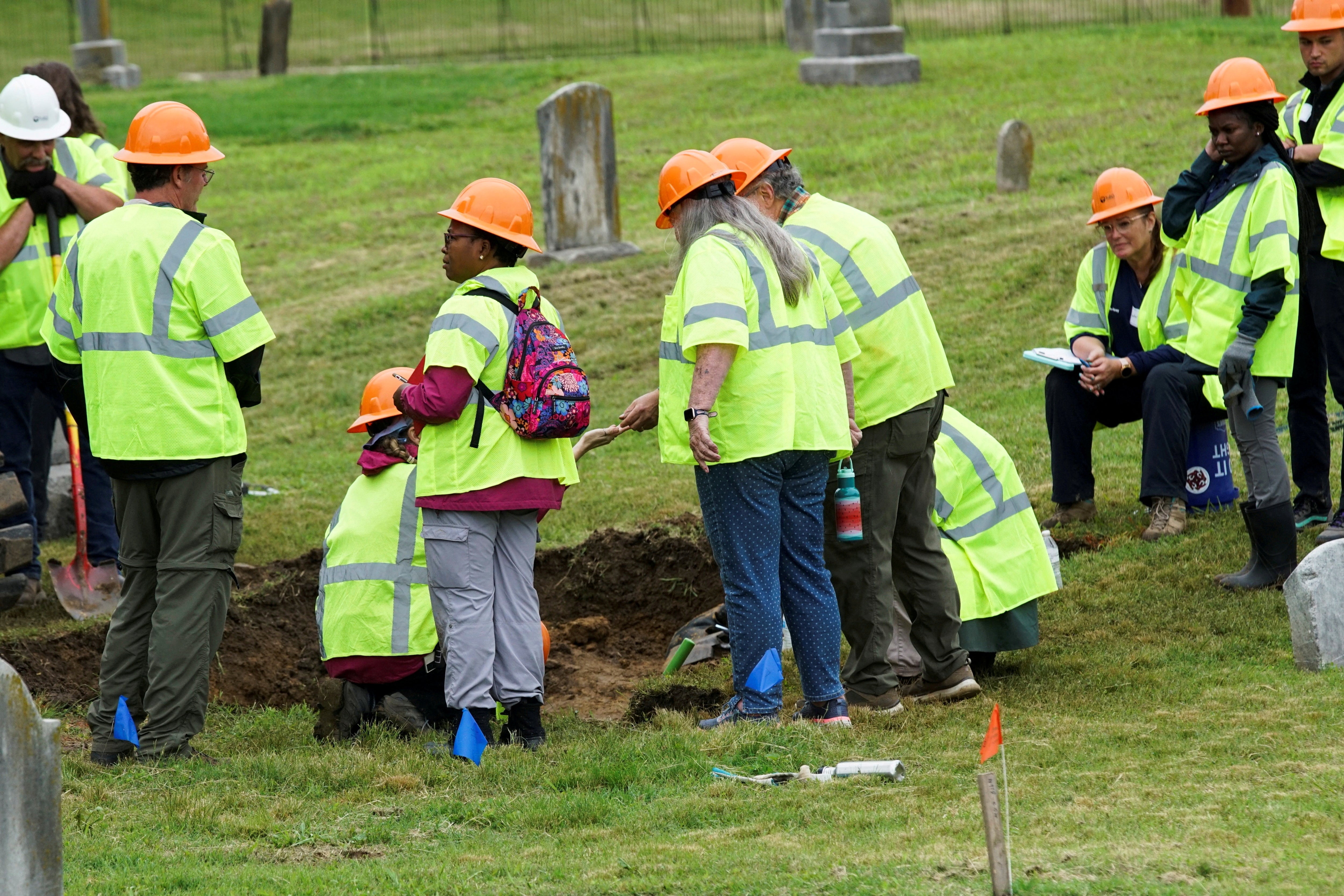 Crews working to excavate potential remains from the 1921 Tulsa race massacre are pictured 100 years later in 2021