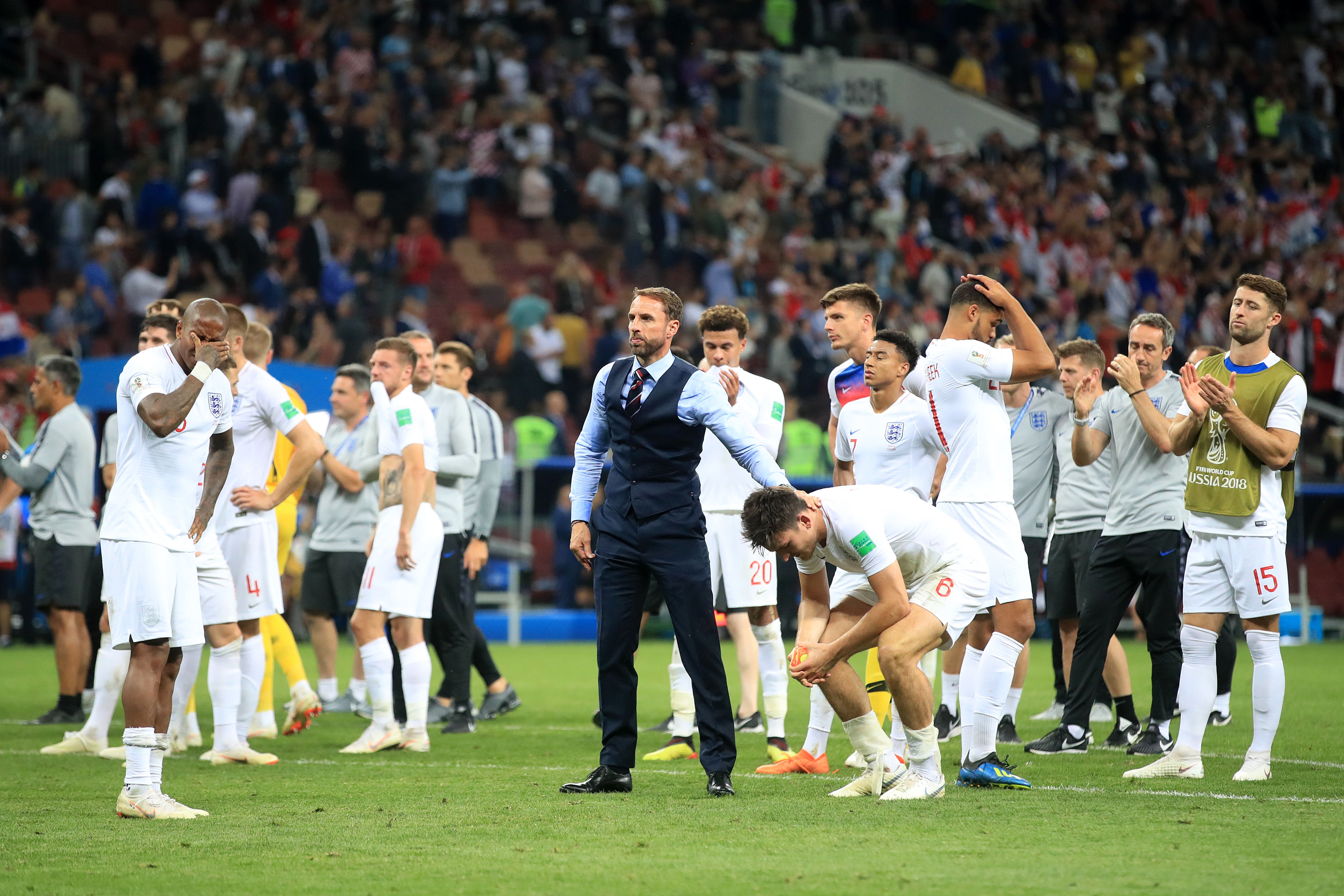 England boss Gareth Southgate consoles defender Harry Maguire after the World Cup semi-final defeat by Croatia (Adam Davy/PA)