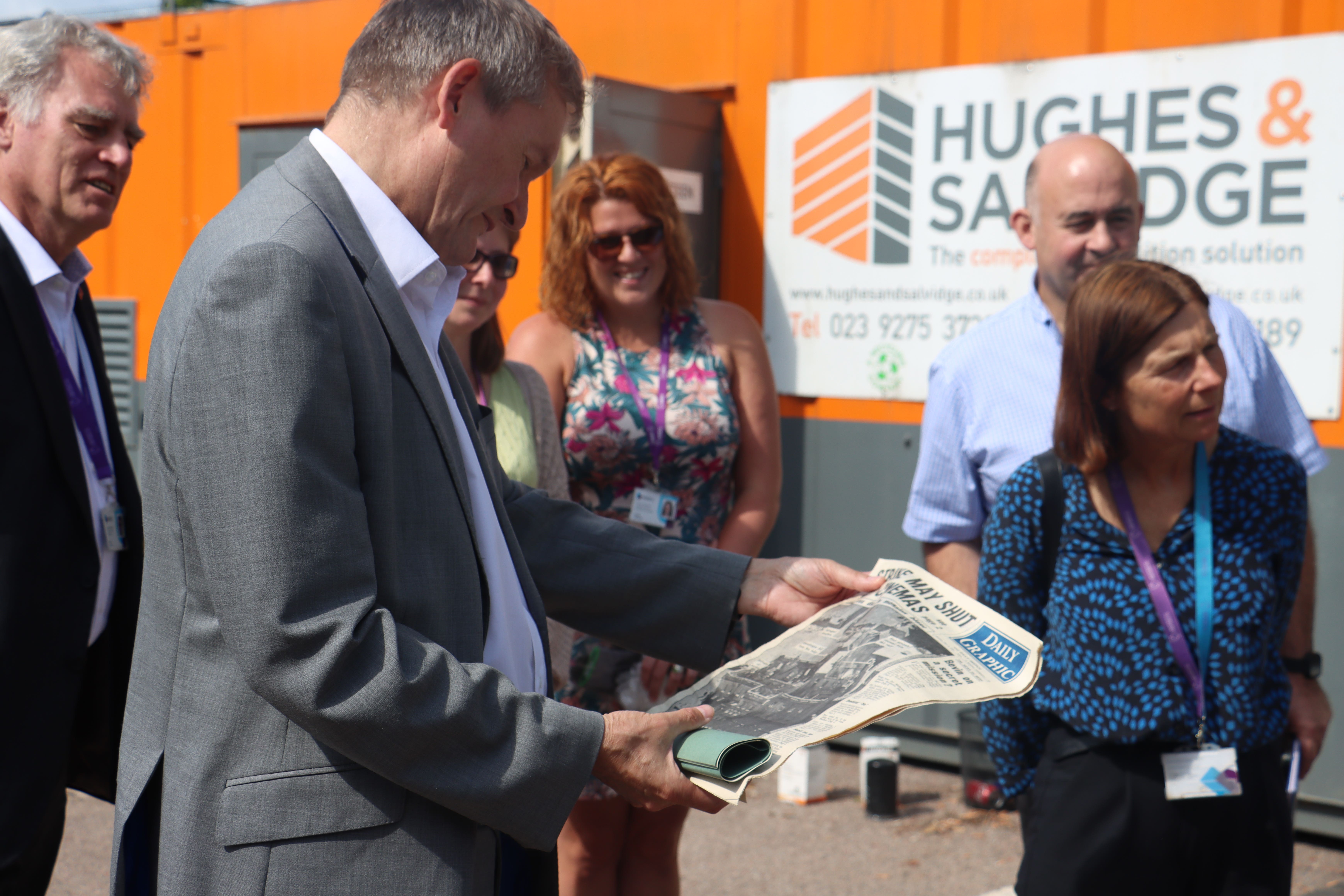 A time capsule buried 74 years ago containing a half crown coin and newspapers has been found during the demolition of a university building (University of Portsmouth/PA)