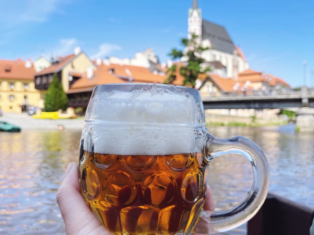 Balancing Budvar beer while rafting in Cesky Krumlov