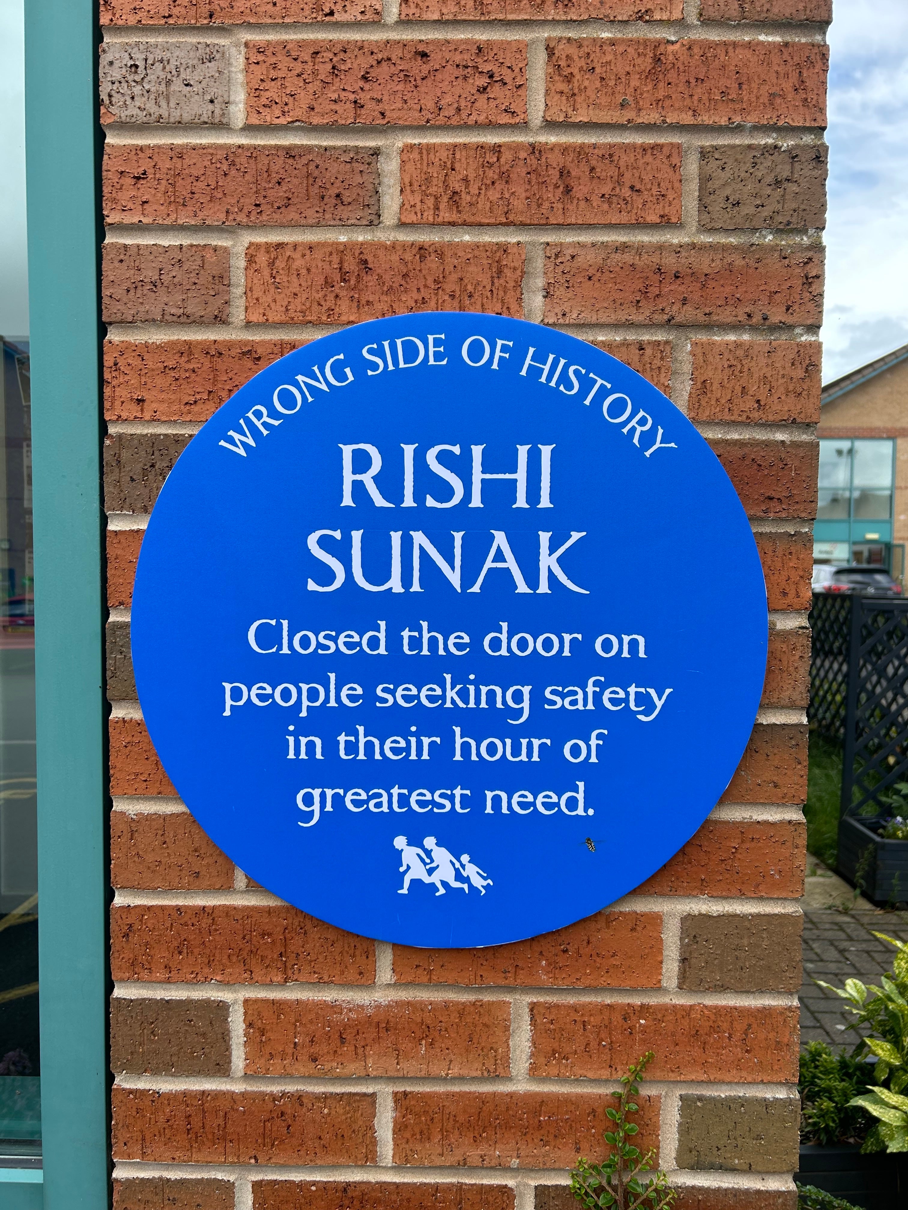 Freedom From Torture campaigners put up blue plaque