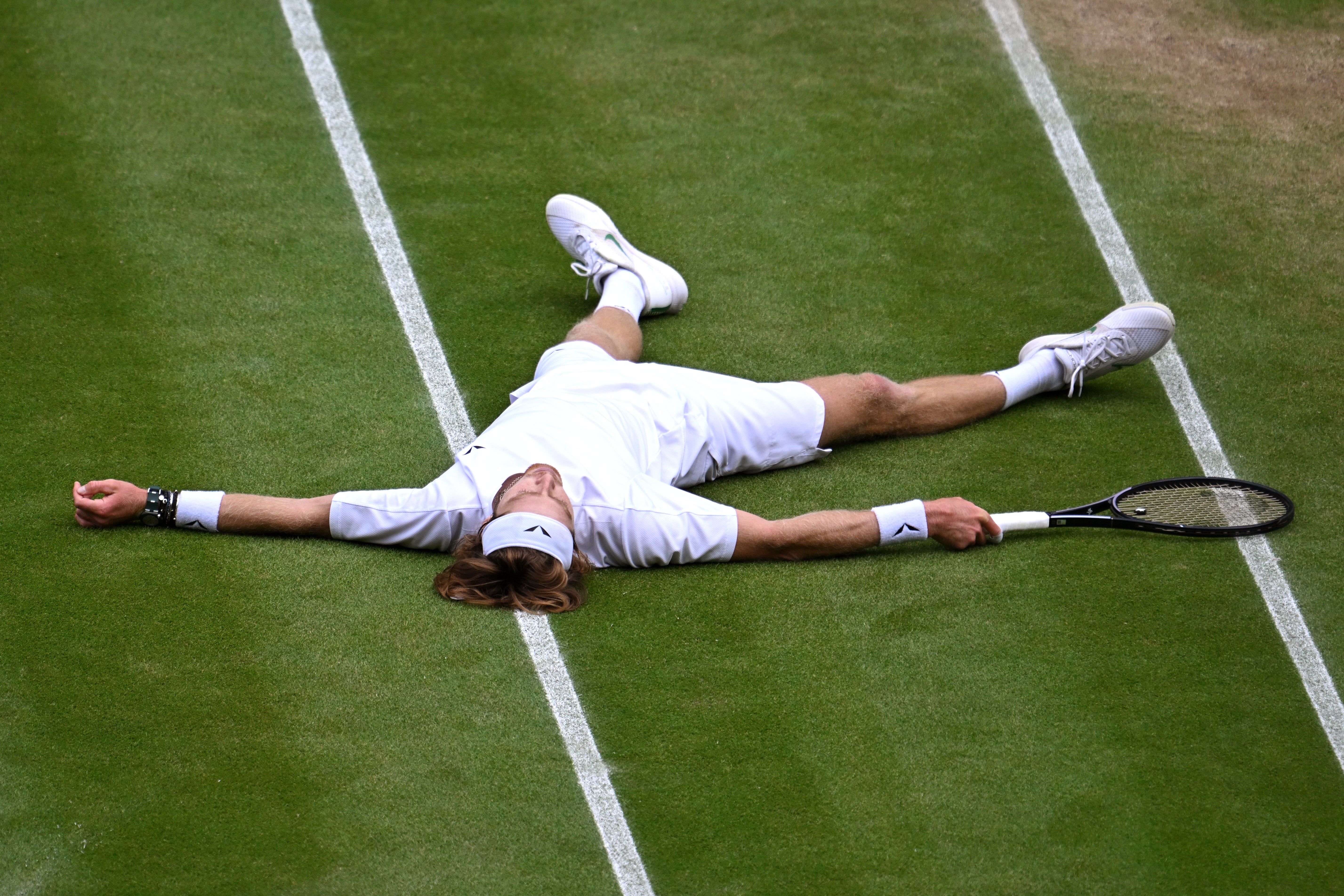 Rublev after failing to return a Djokovic drop shot