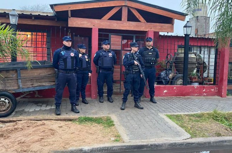 Police are pictured at the scene where Trinidad was killed