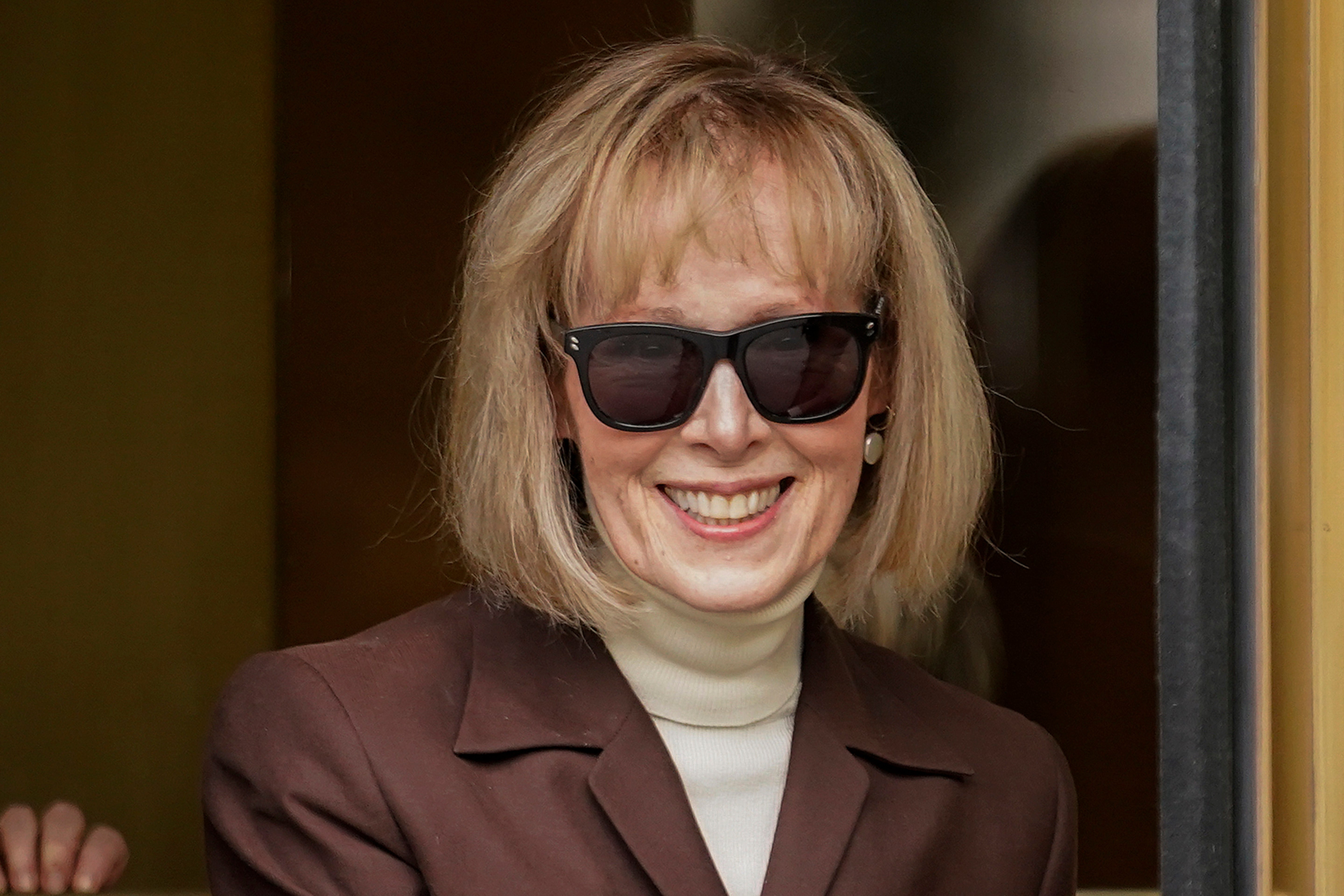 E Jean Carroll leaves a Manhattan courthouse after a jury found the former president liable for sexual assault and defamation