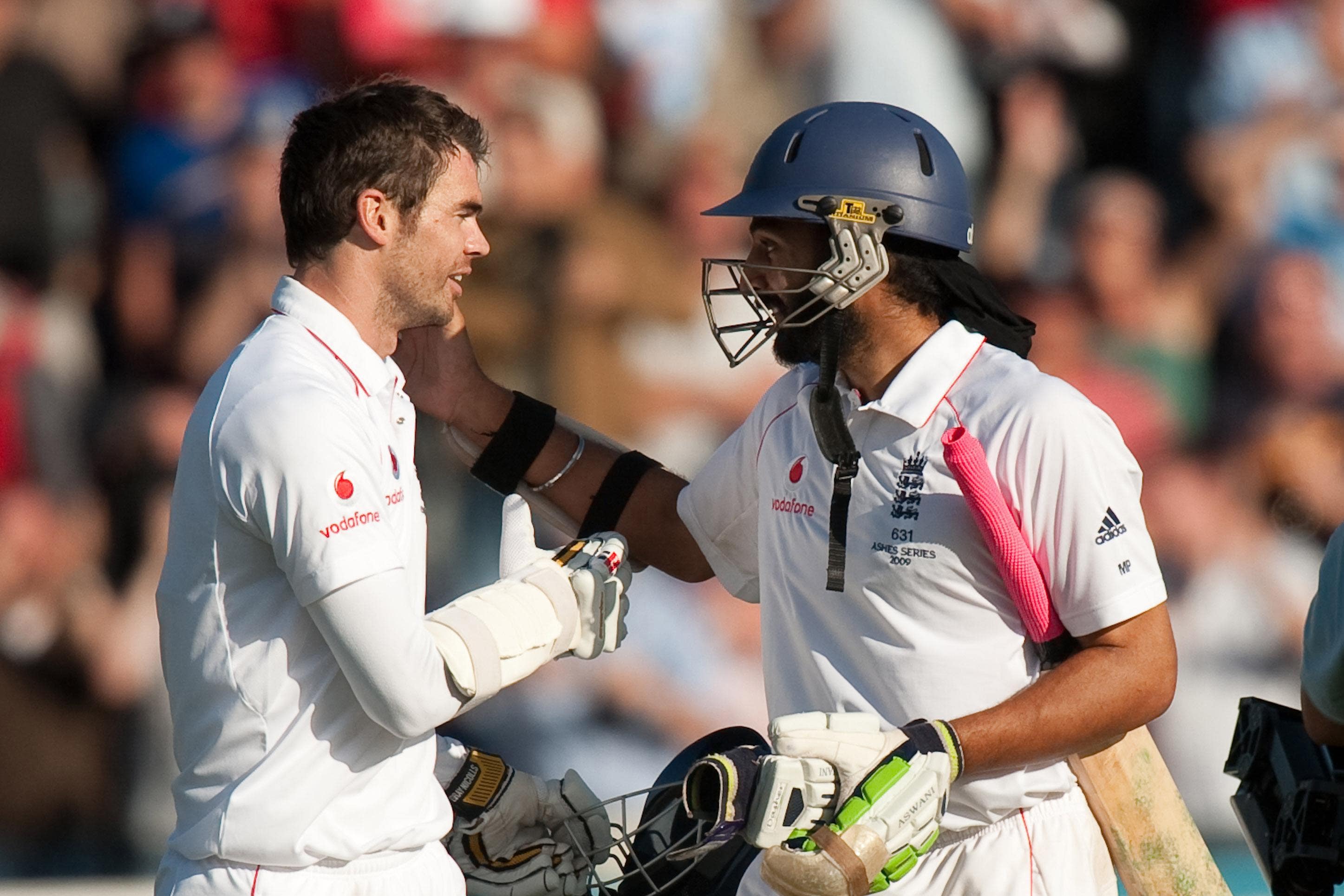 James Anderson and Monty Panesar embrace after edging England to a draw in the first Ashes Test in Cardiff (Gareth Copley/PA)