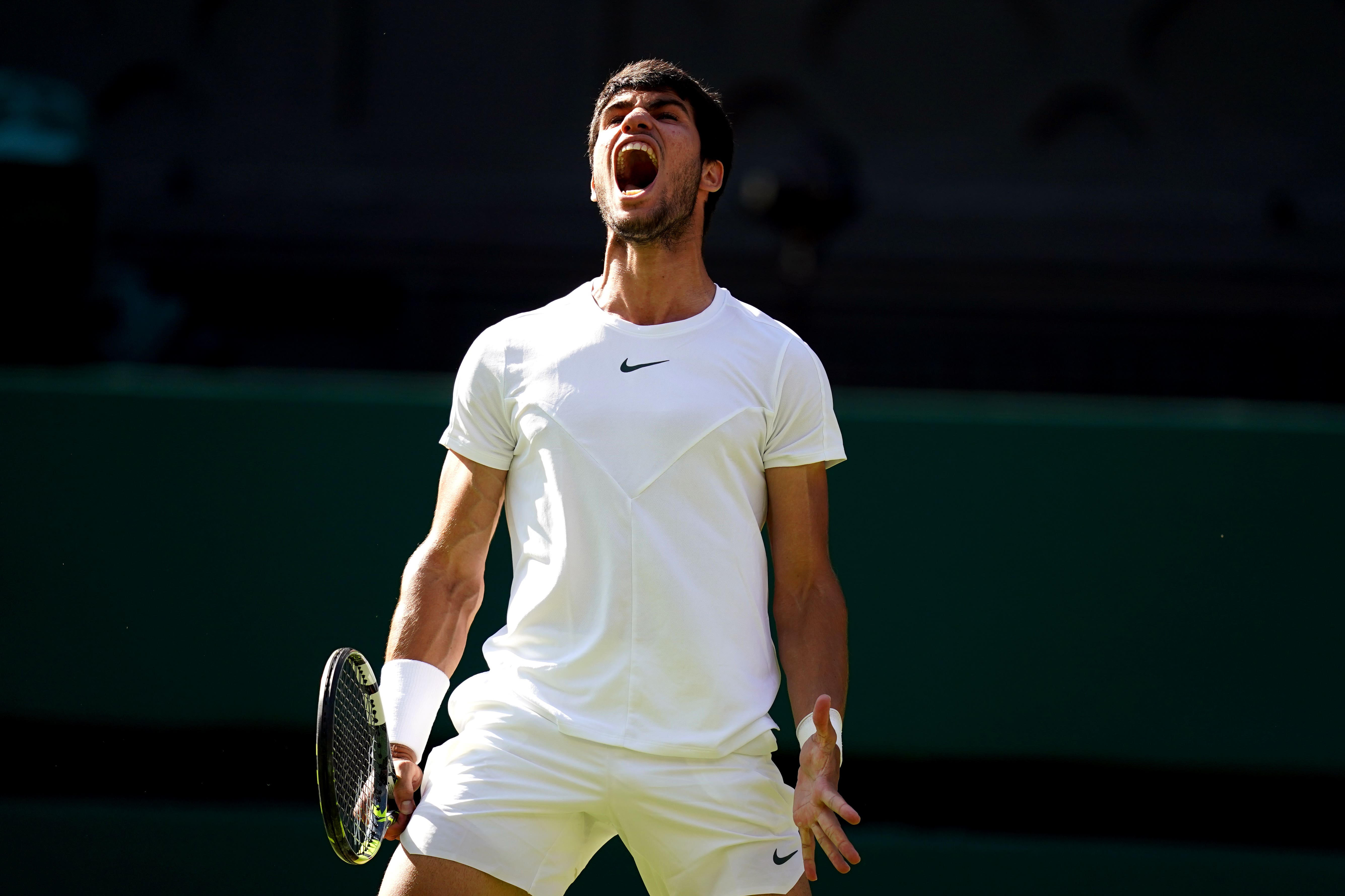 Carlos Alcaraz beat Holger Rune in straight sets to reach the Wimbledon semi-finals (John Walton/PA)