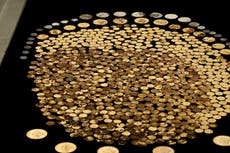 Man discovers hundreds of gold coins buried in his cornfield that could be worth millions