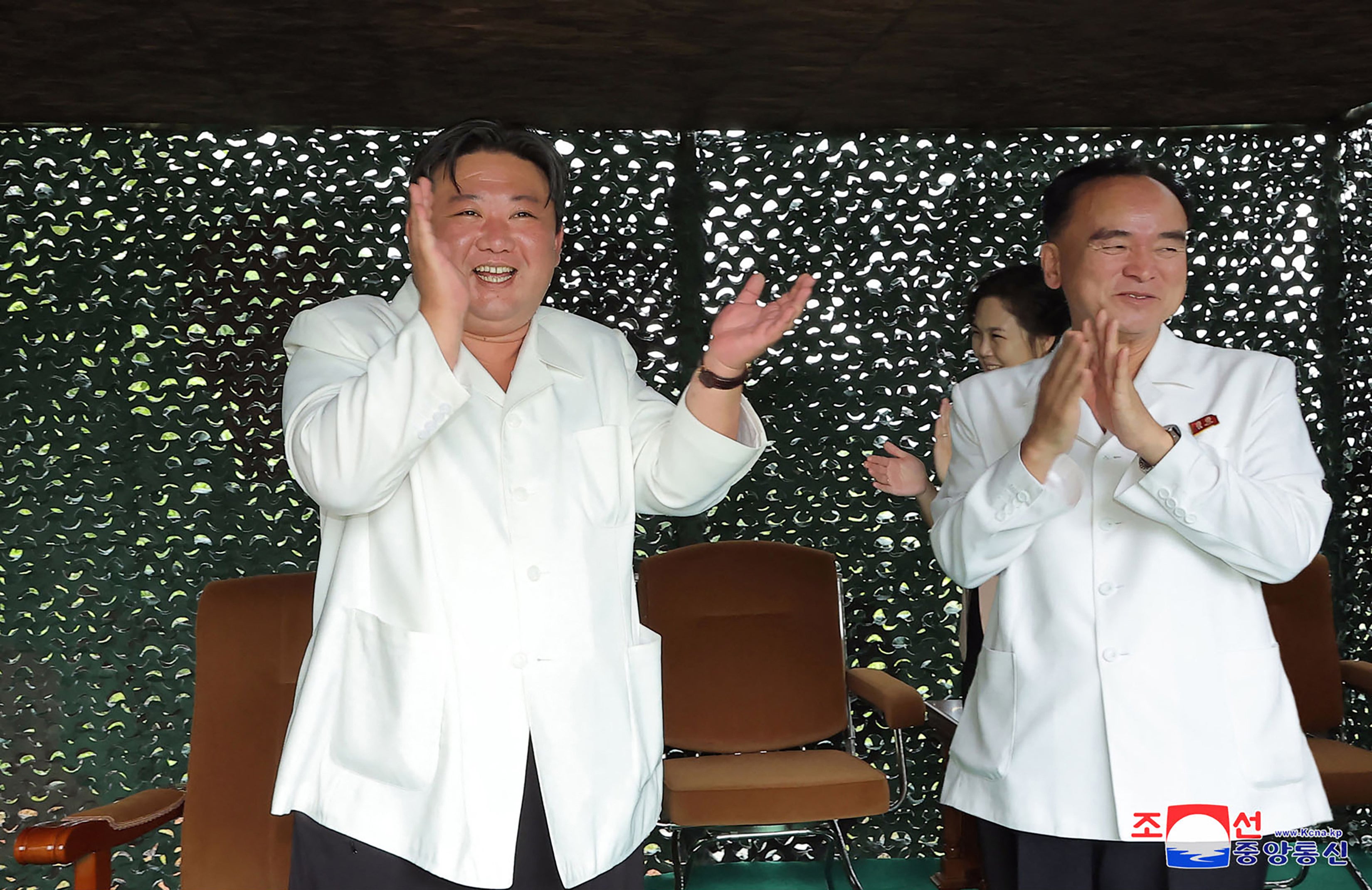 North Korea threatens US after record ICBM launch as pictures of delighted Kim Jong-un emerge