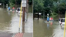 Residents kayak through flooded town as Vermont hit by severe flooding