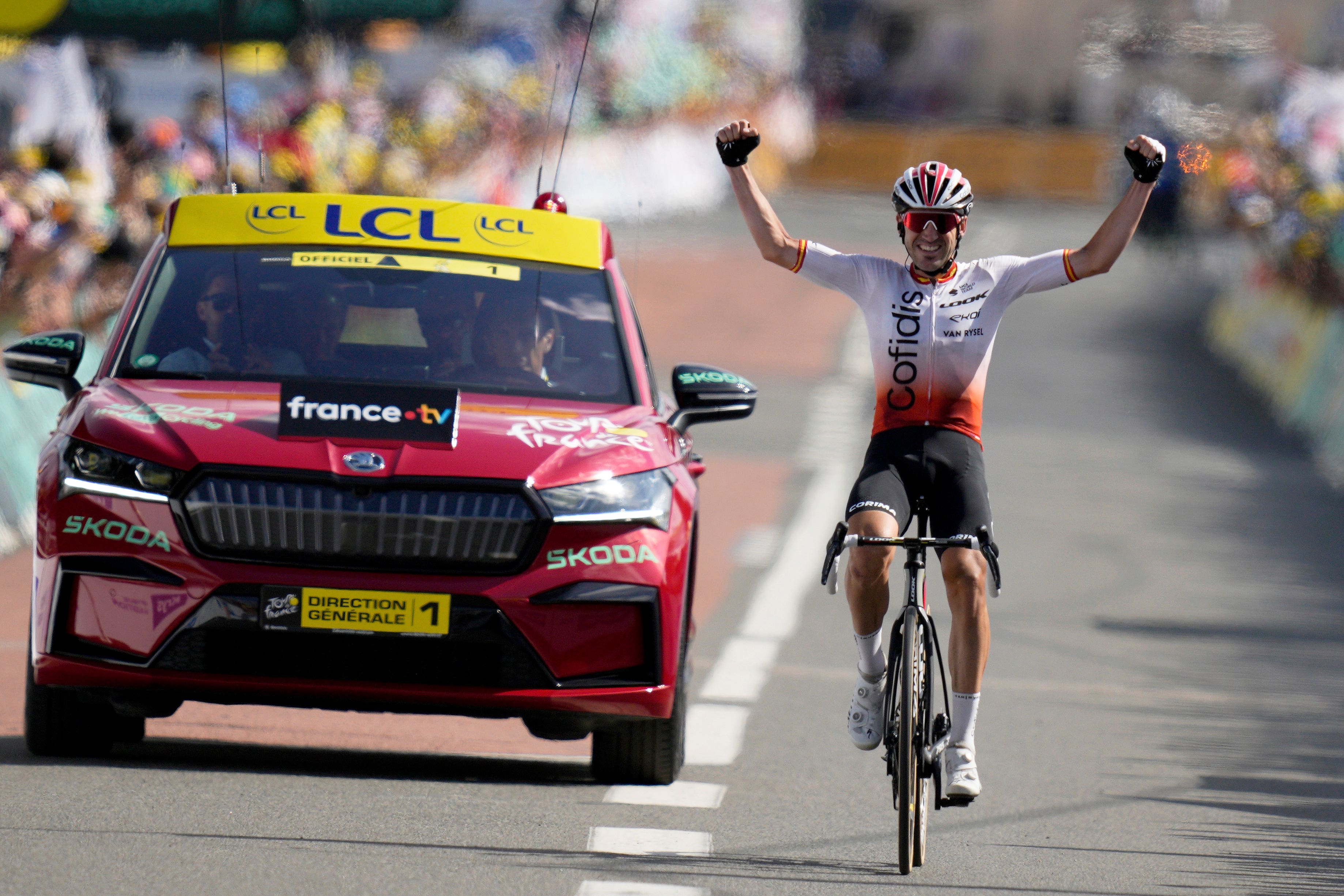 The Ion and only: Ion Izagirre celebrates as he crosses the line alone in Belleville-en-Beaujolais