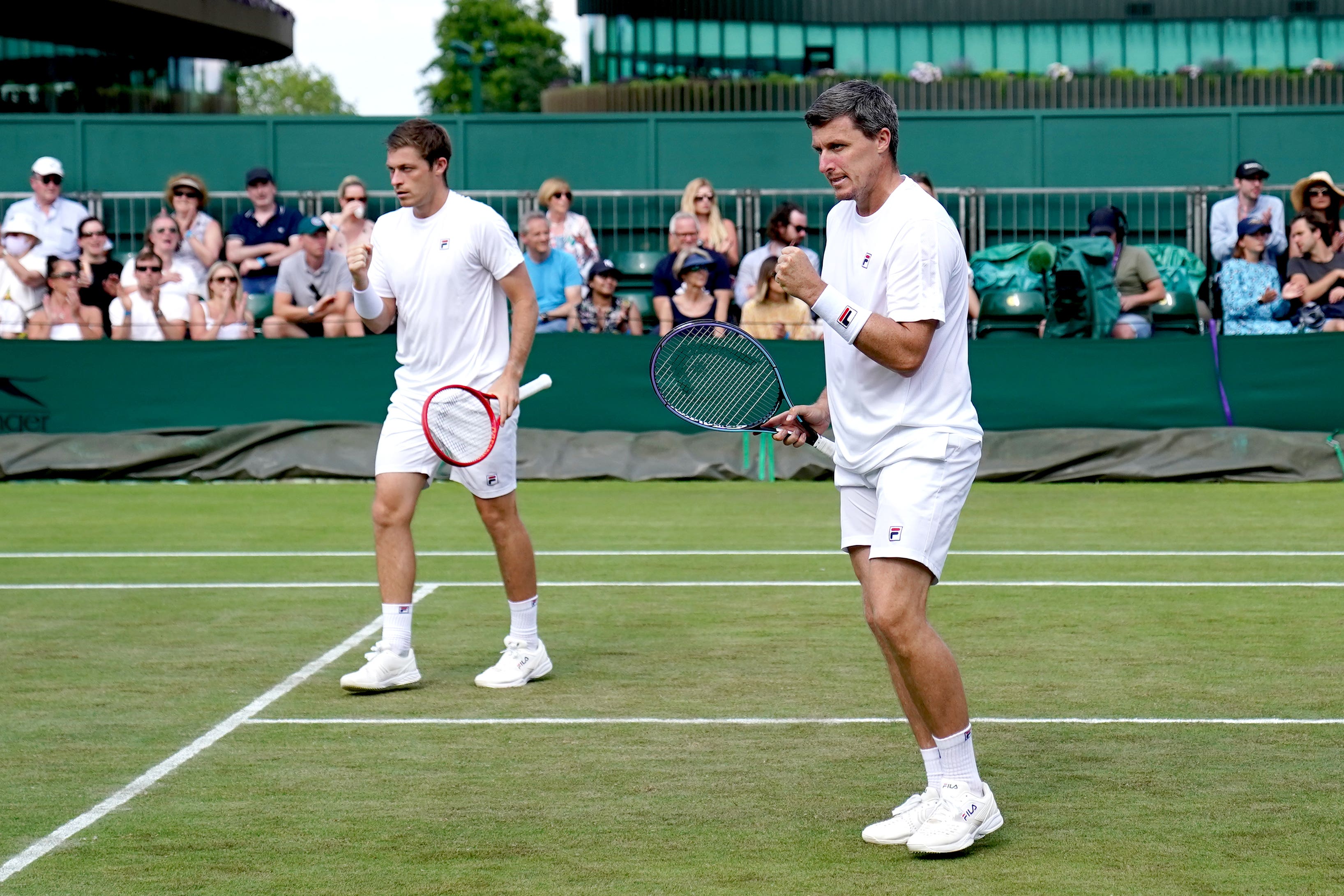 Ken Skupski, right, is now his younger brother Neal’s coach (John Walton/PA)