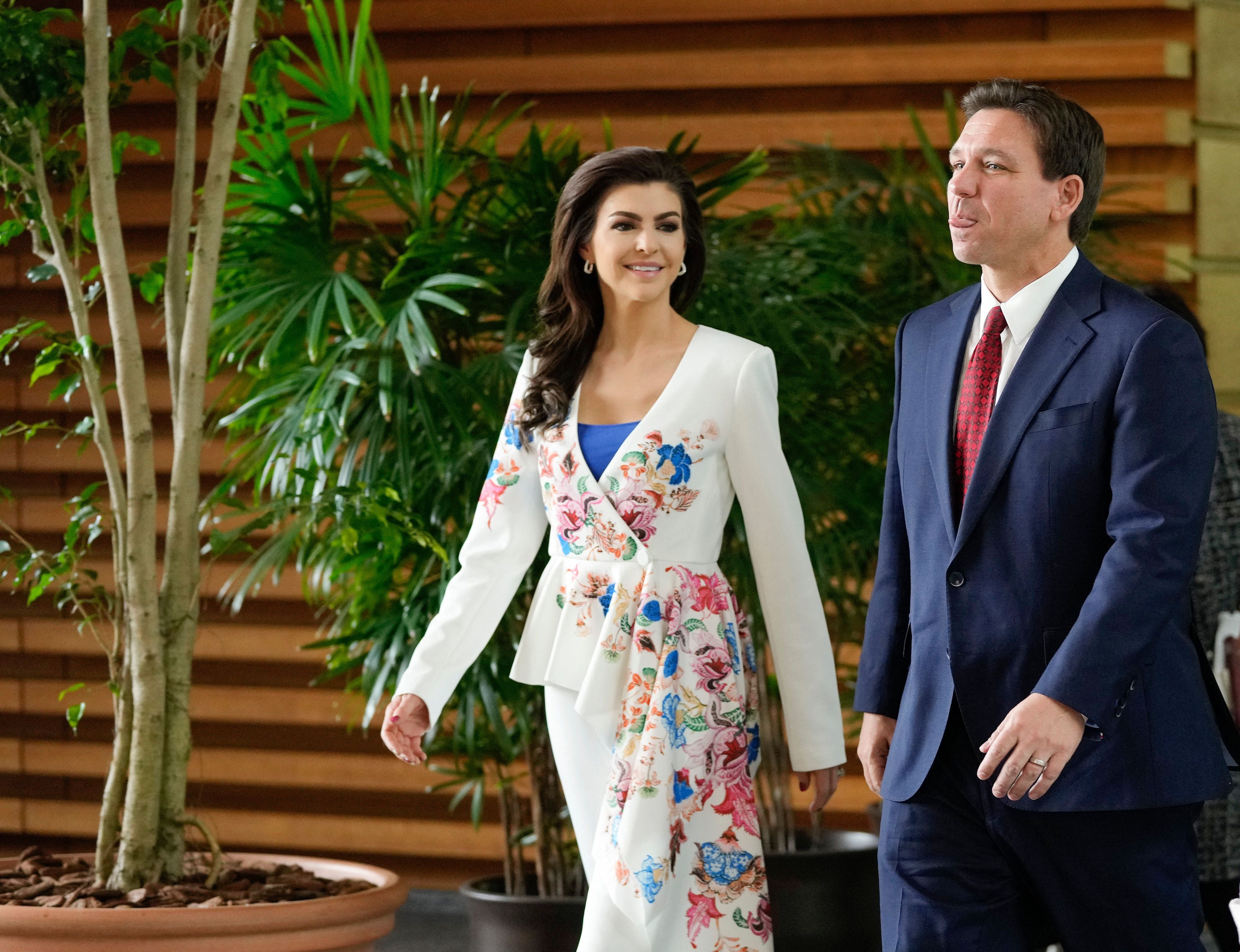 Ron and Casey hold hands as they leave Japan's premier's official residence on a trip to Tokyo