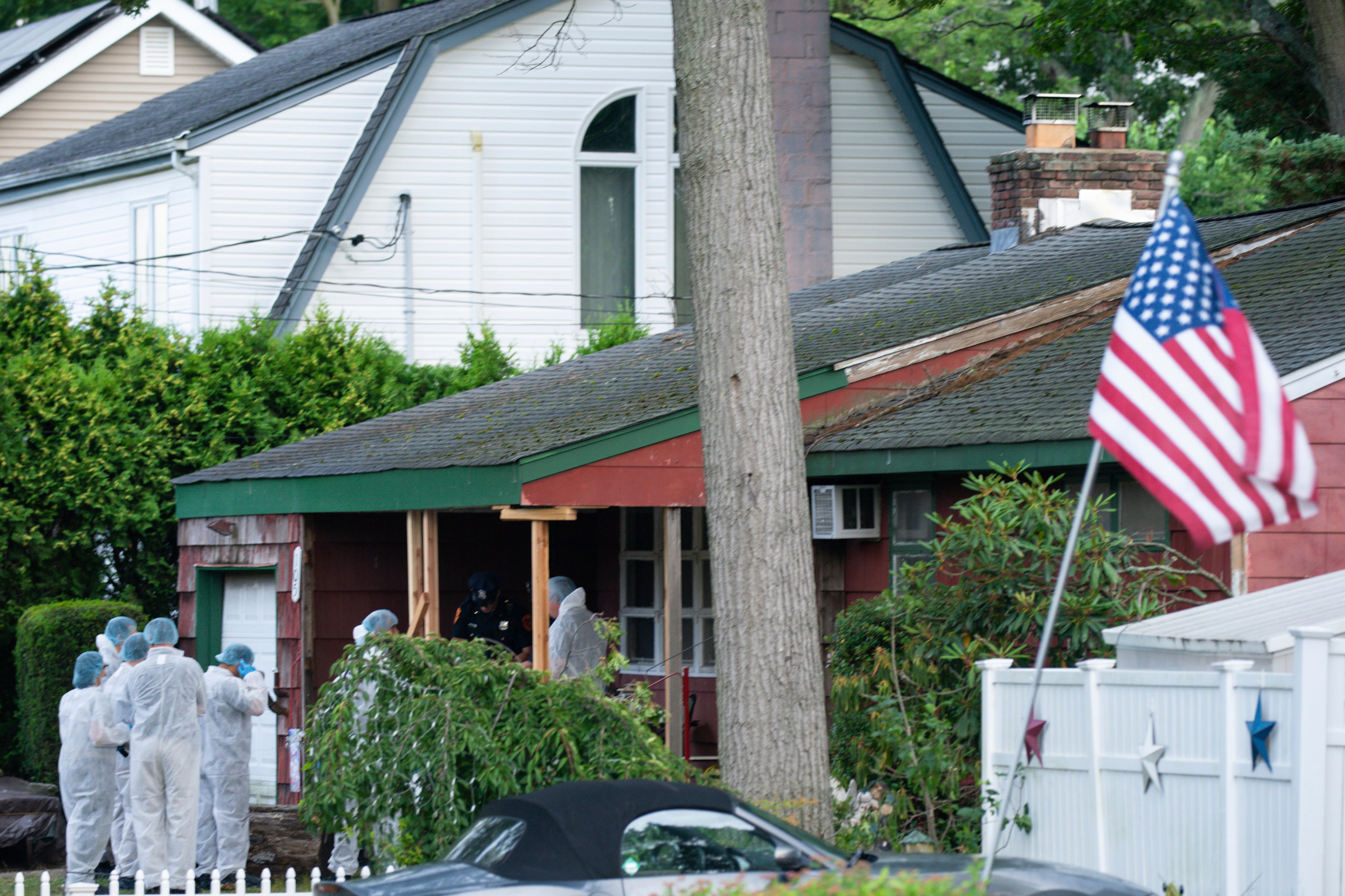 Crime laboratory officers at the home of Rex Heuermann on July 14, 2023, in Massapequa Park, after he was arrested for the Gilgo Beach killings