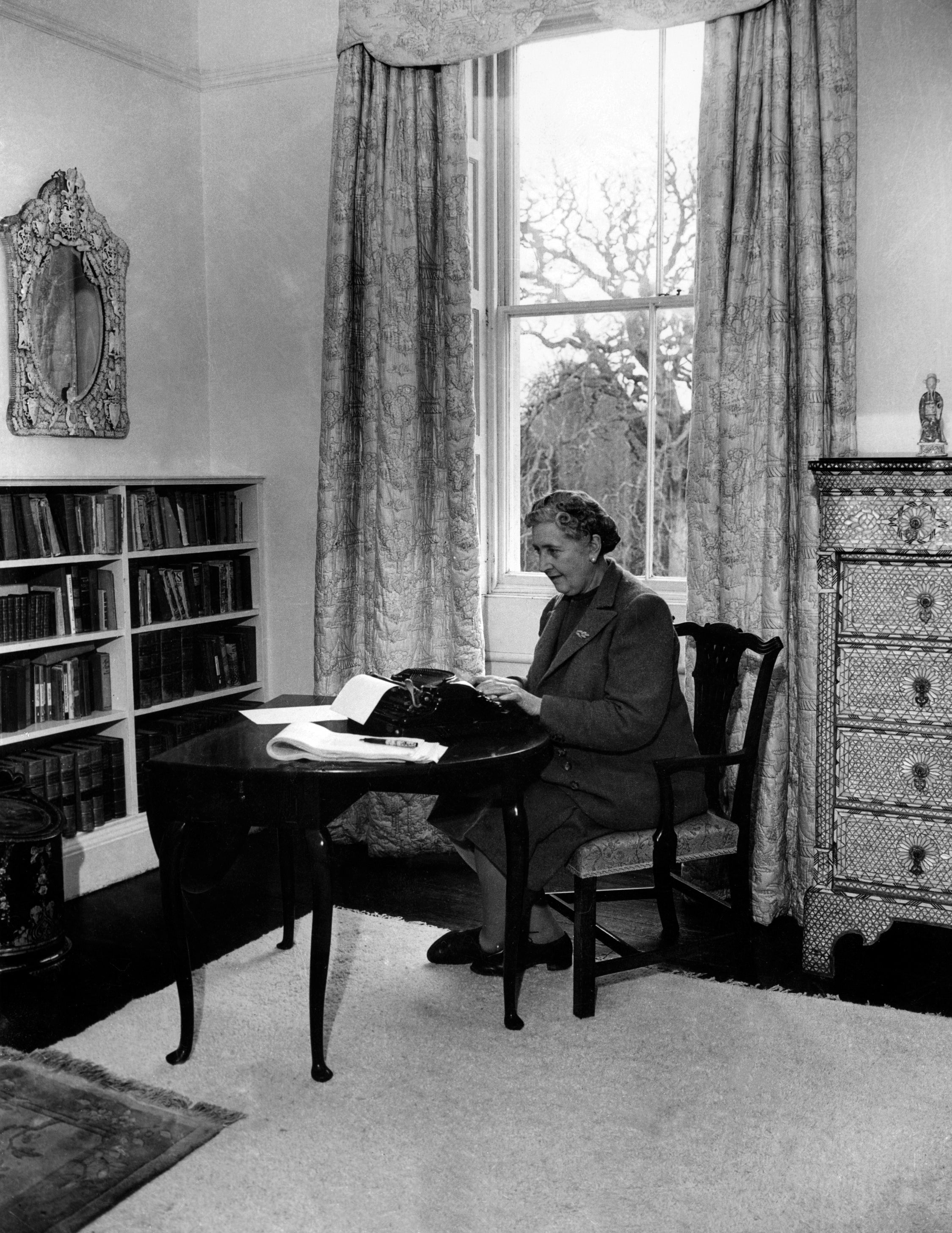 English writer Dame Agatha Christie, at work on a typewriter in March 1946 in her home, Greenway House, in Devon