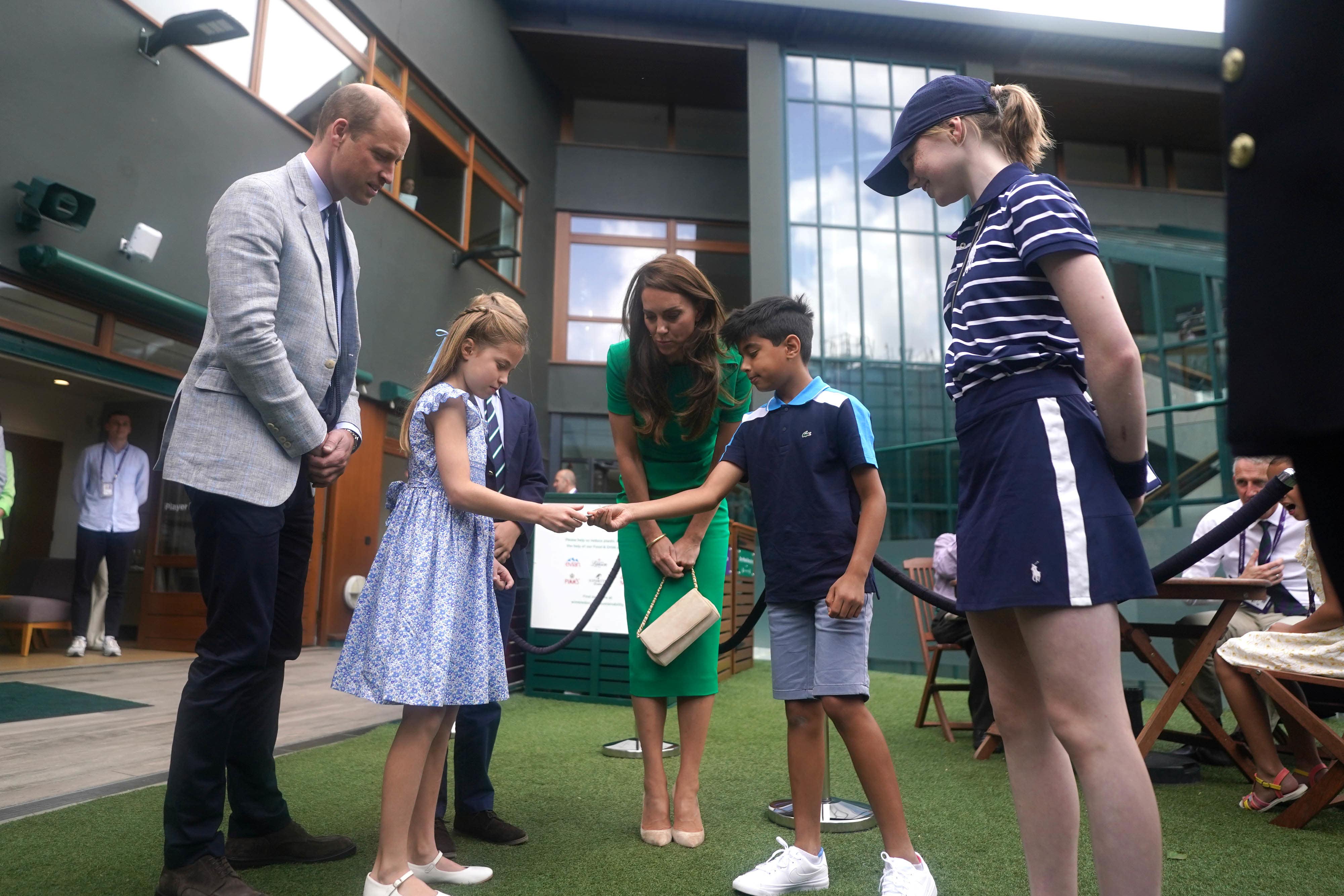 The Prince and Princess of Wales with Prince George and Princess Charlotte spoke to Mu’awwiz Anwar (Victoria Jones/PA)