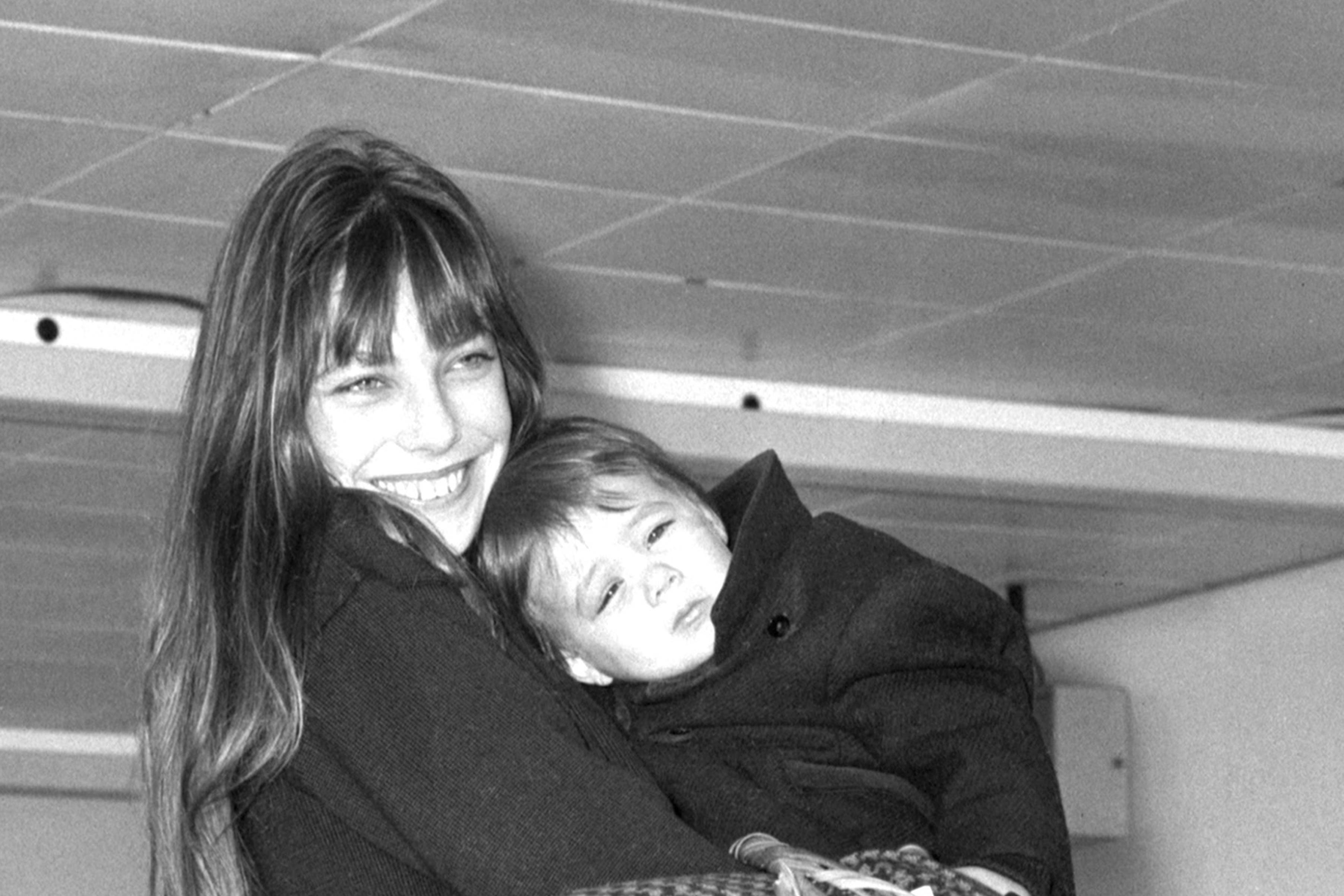 Jane Birkin with her 18-month-old daughter Charlotte at Heathrow Airport in December 1972