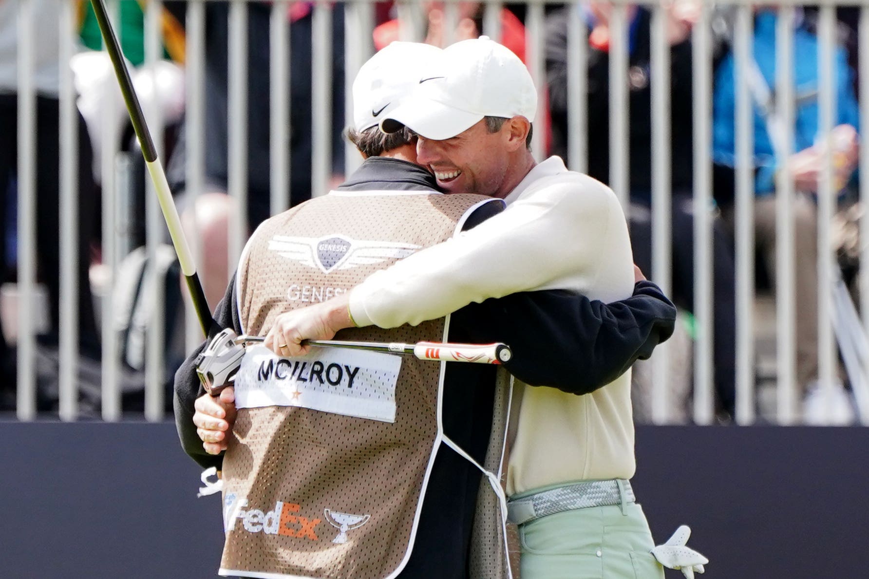 Rory McIlroy celebrates with caddie Harry Diamond after winning the Genesis Scottish Open (Jane Barlow/PA)