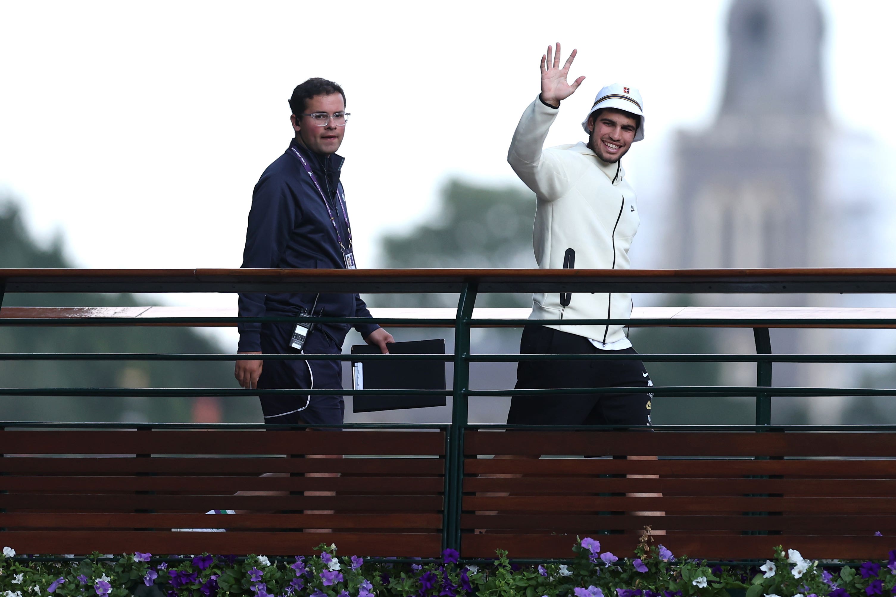 Carlos Alcaraz sporting the Nike tennis bucket hat after his win (Steven Paston/PA)