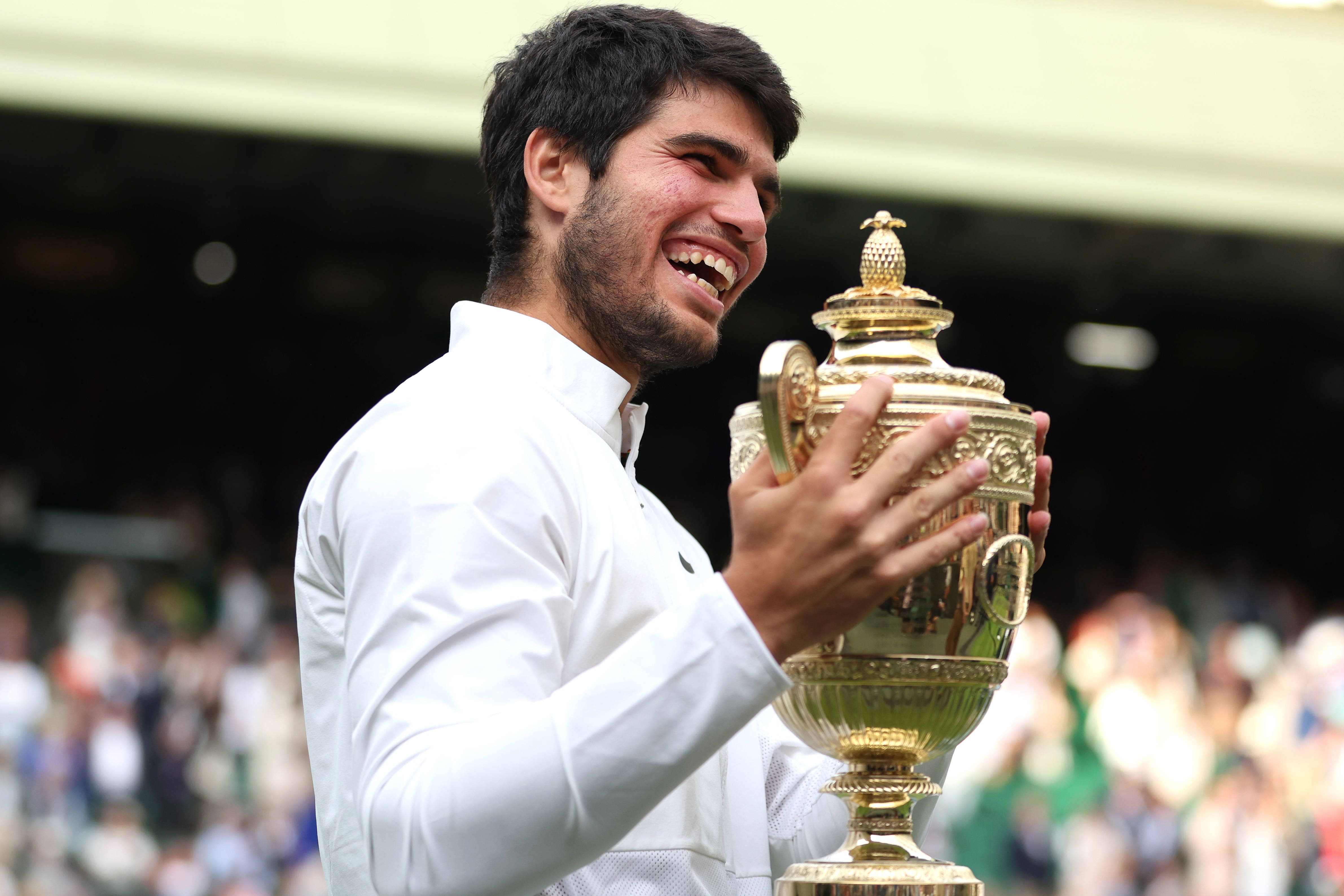 Carlos Alcaraz with the Wimbledon trophy (Steven Paston/PA)