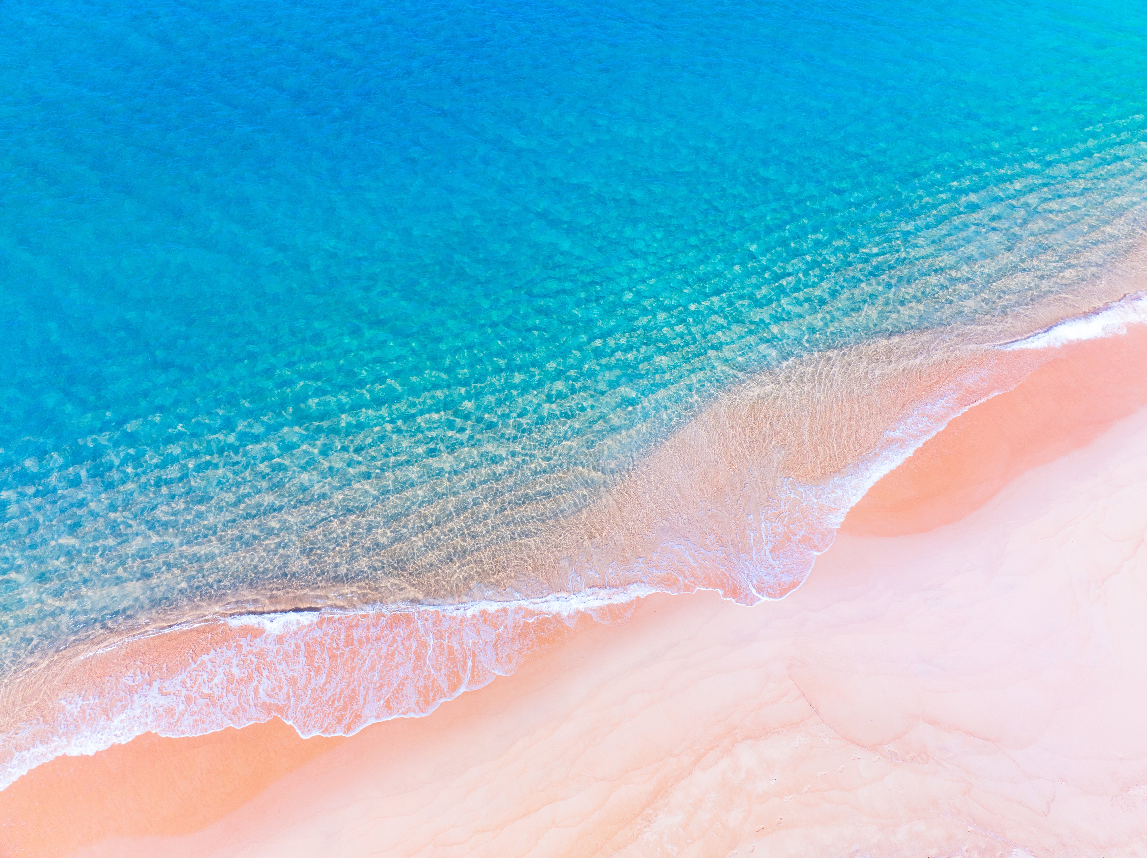 Pastel sands and turquoise water on the Bahamas’ Pink Sand Beach