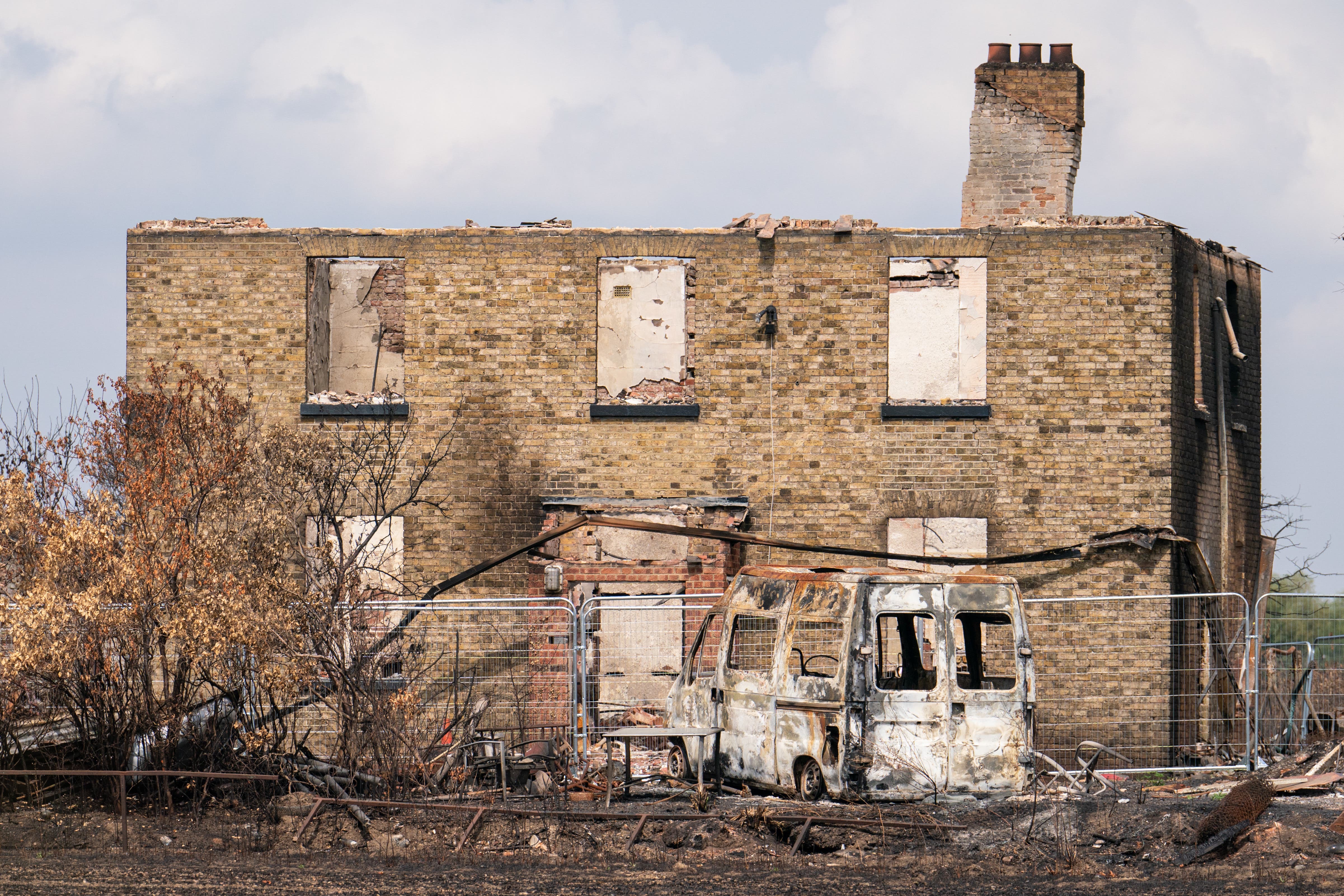 Firefighters still do not know the exact cause of the Wennington fire on July 19 last year but the hot, dry and windy conditions brought on by the 40C heat amplified its destructive power (Dominic Lipinski/PA)