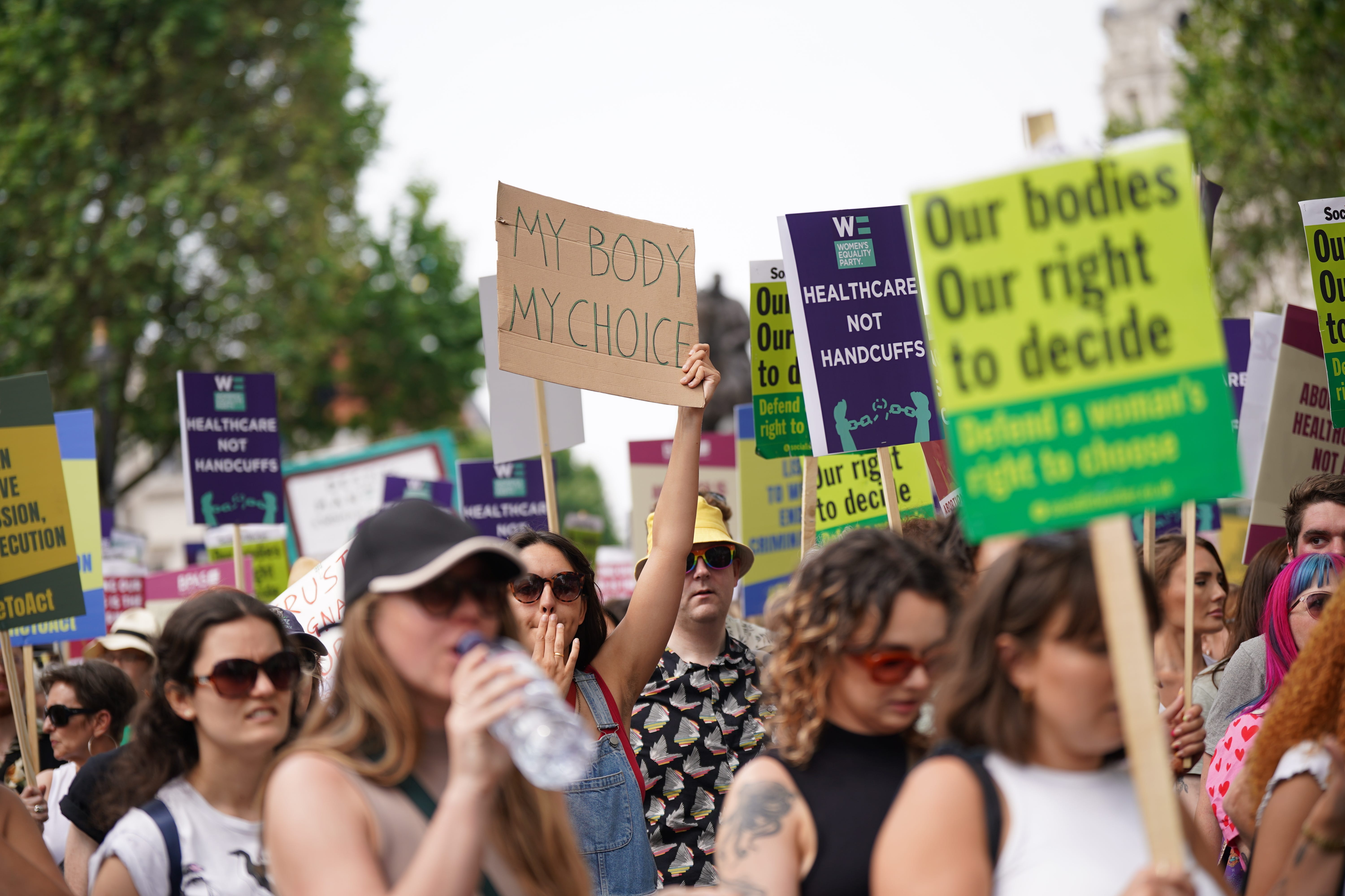 Campaigners in Westminster after taking part in a march from the Royal Courts of Justice calling for decriminalisation of abortion after Foster’s sentencing (Yui Mok/PA)