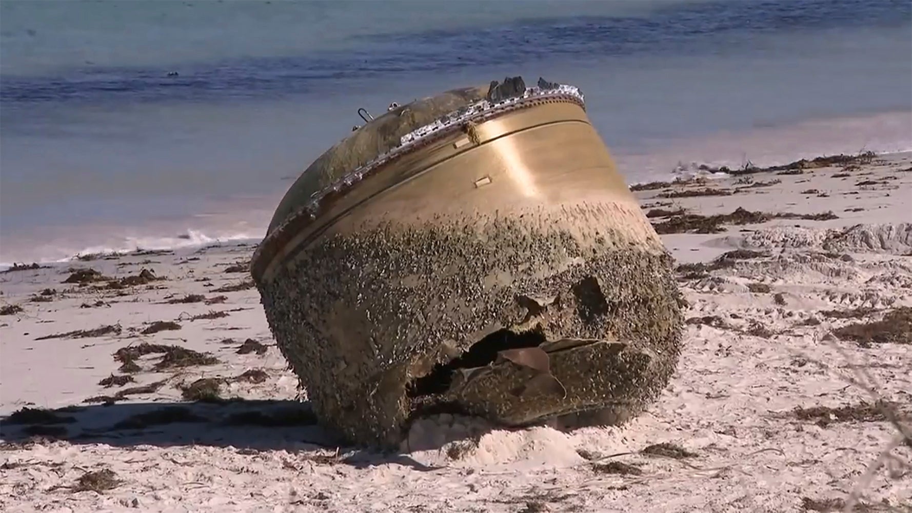 In this image made from video, a cylindrical object is seen on beach in Green Head, Australia