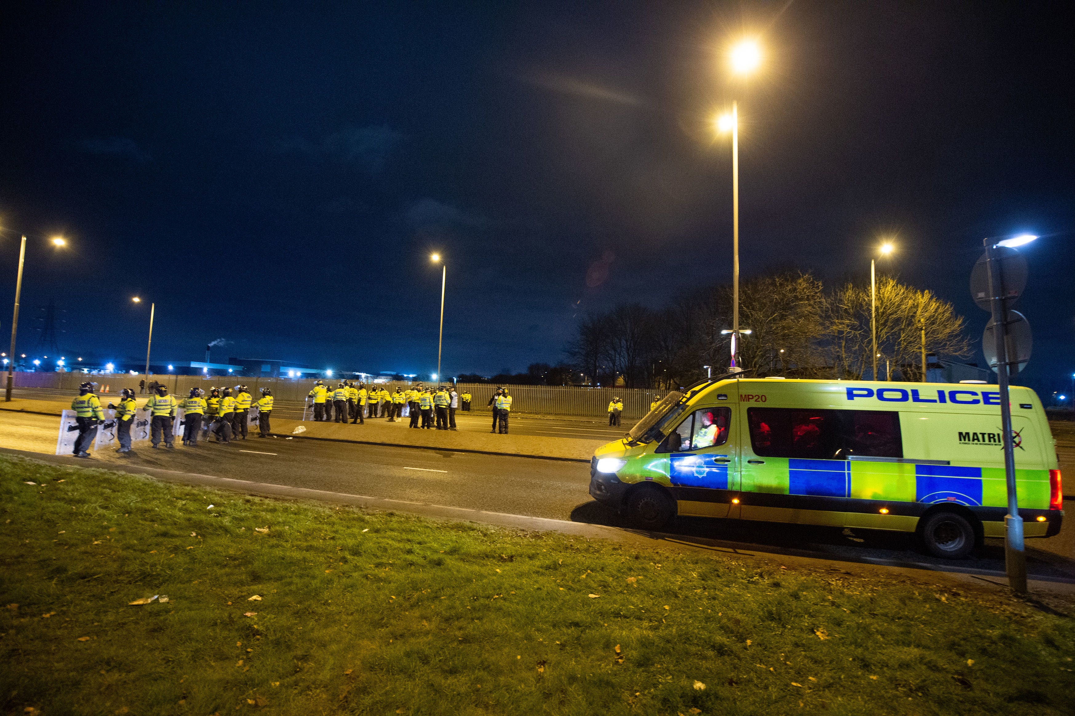 Police in riot gear after a demonstration outside the Suites Hotel in Knowsley, Merseyside (Peter Powell/PA)