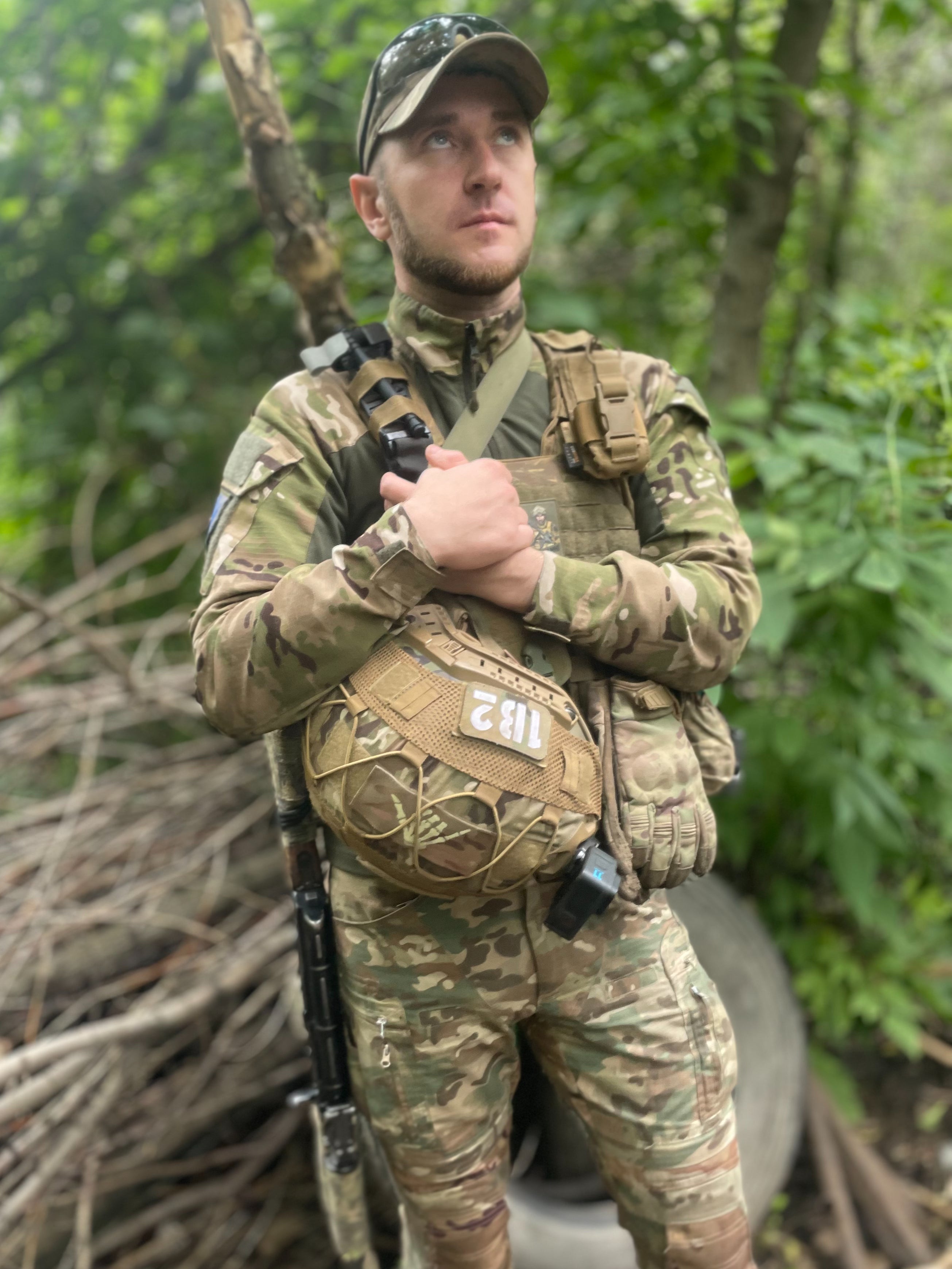 Sergeant Boroda looks to the skies while out on patrol