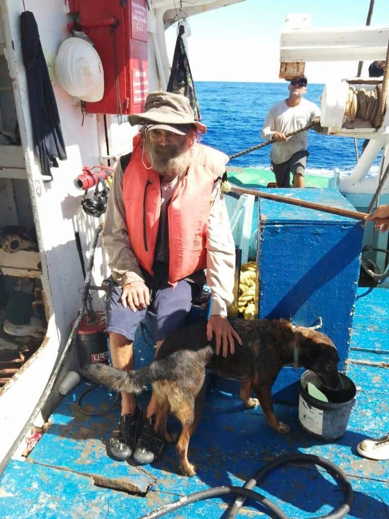 Mr Shaddock sits with Bella after being rescued by a Mexican tuna boat