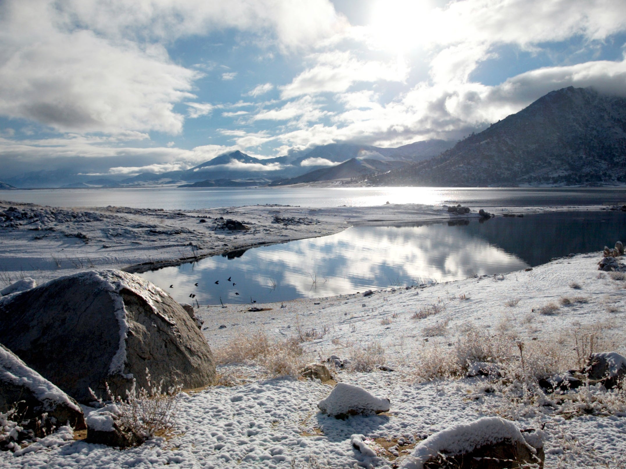 Snow covers the shores and surrounding area of Lake Isabella, Calif., Tuesday, Jan. 29, 2002.